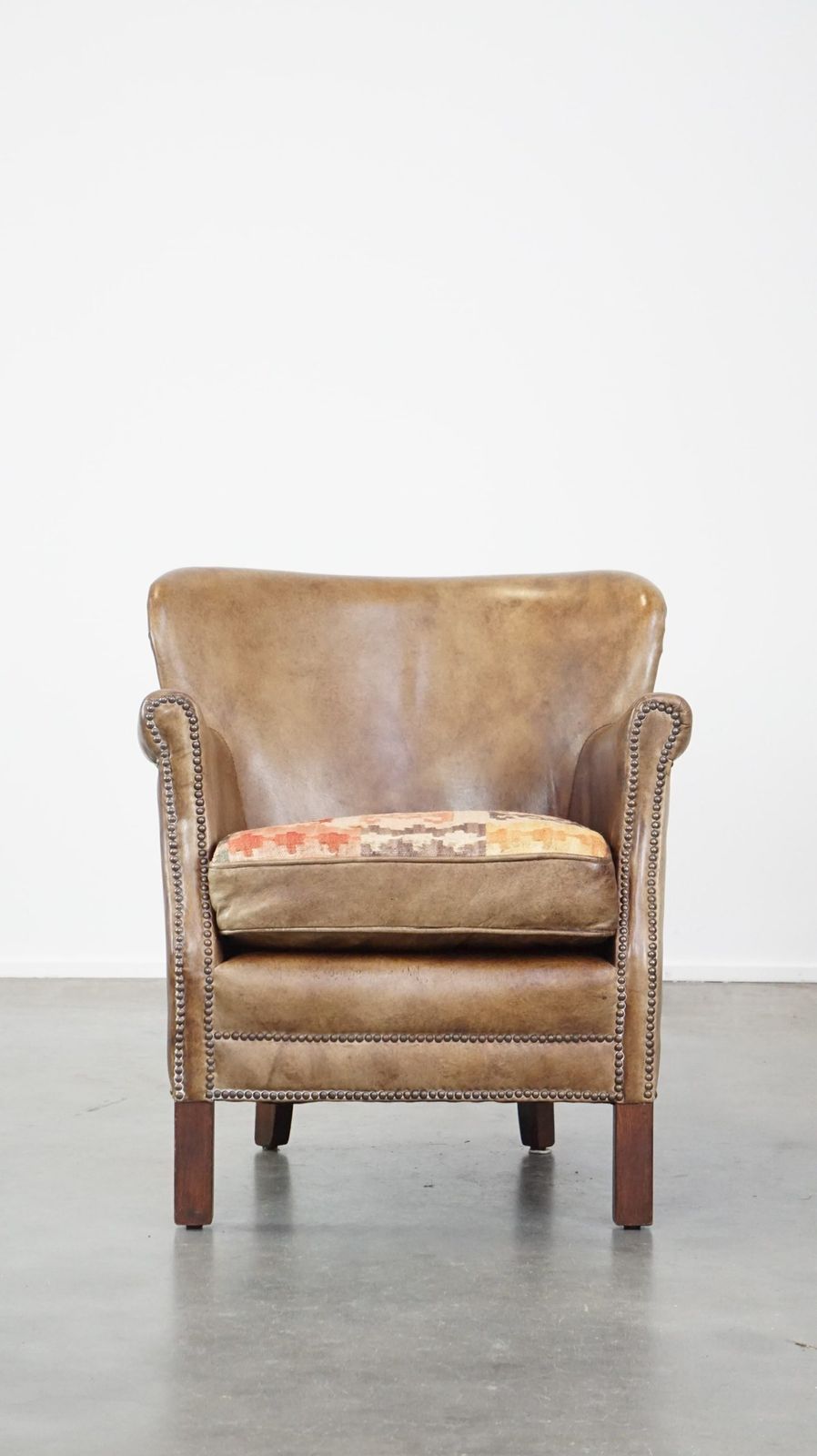 Subtle Cowhide Armchair With A Reversible Kilim Seat Cushion photo furniture