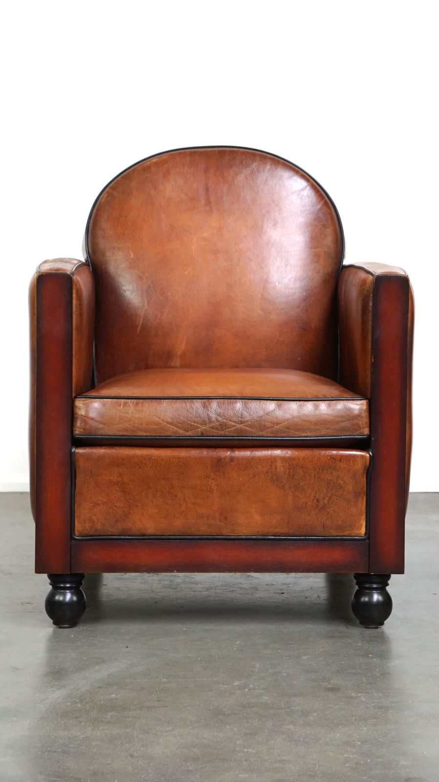 Sheepskin Art Deco Design Armchair Finished With Wood And Beautiful Cognac Colored Leather photo furniture