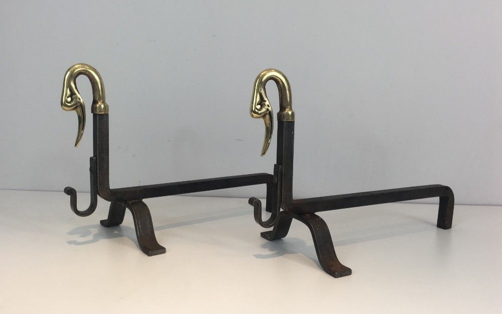 In The Style Of Maison Jansen. Pair Of Iron And Brass Andirons With Duck Heads. photo for sale