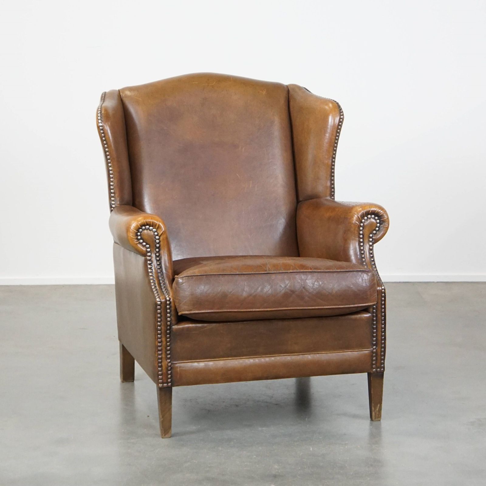 Charming, Subtle English Style Sheepskin Wing Chair With Beautiful Colours And Excellent Seating Comfort