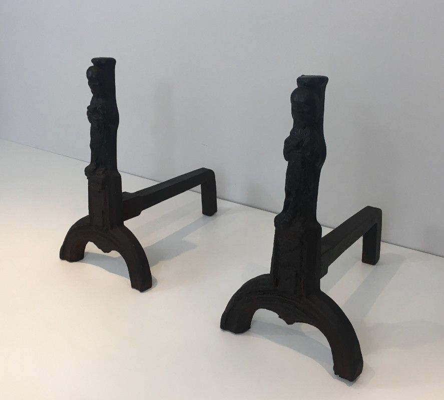 Pair Of Cast Iron Andirons Representing An Evangelist. photo furniture