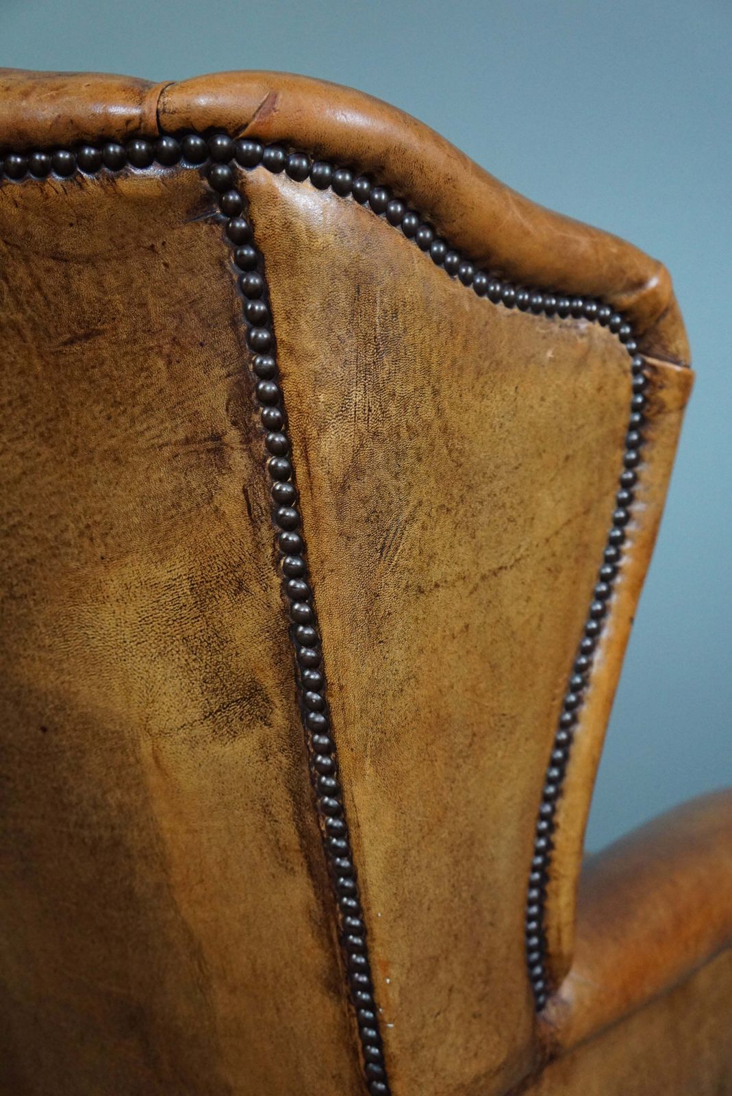 photo for sale Expressive Cognac Colored Sheepskin Wing Chair