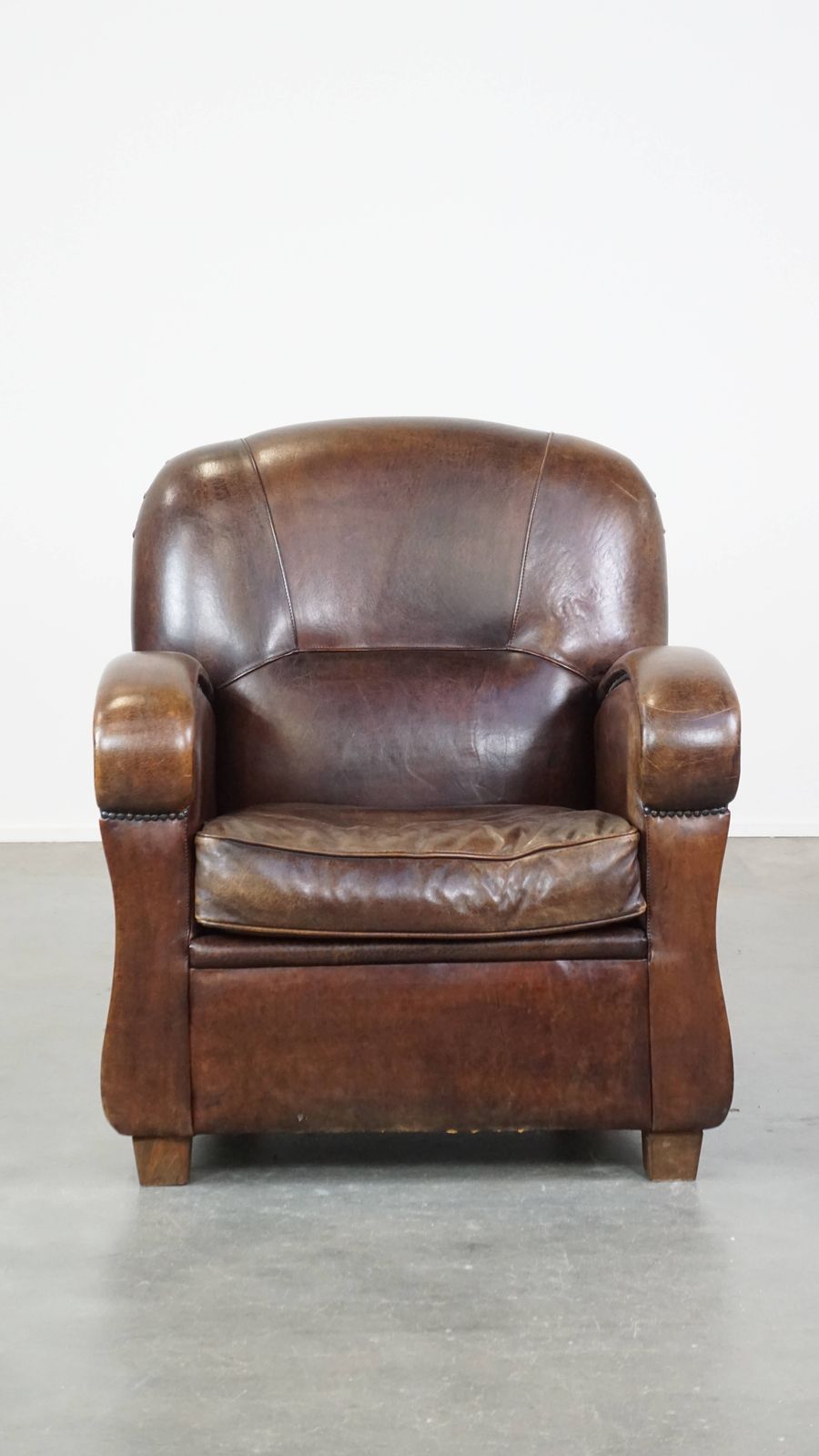 Royal And In Good Condition Dark Sheepskin Armchair With Round Shapes And A Comfortable Seat photo furniture