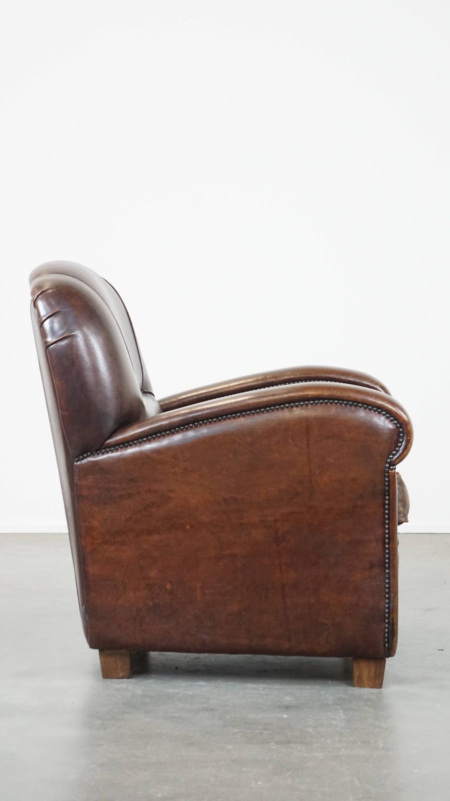 Royal And In Good Condition Dark Sheepskin Armchair With Round Shapes And A Comfortable Seat photo for sale