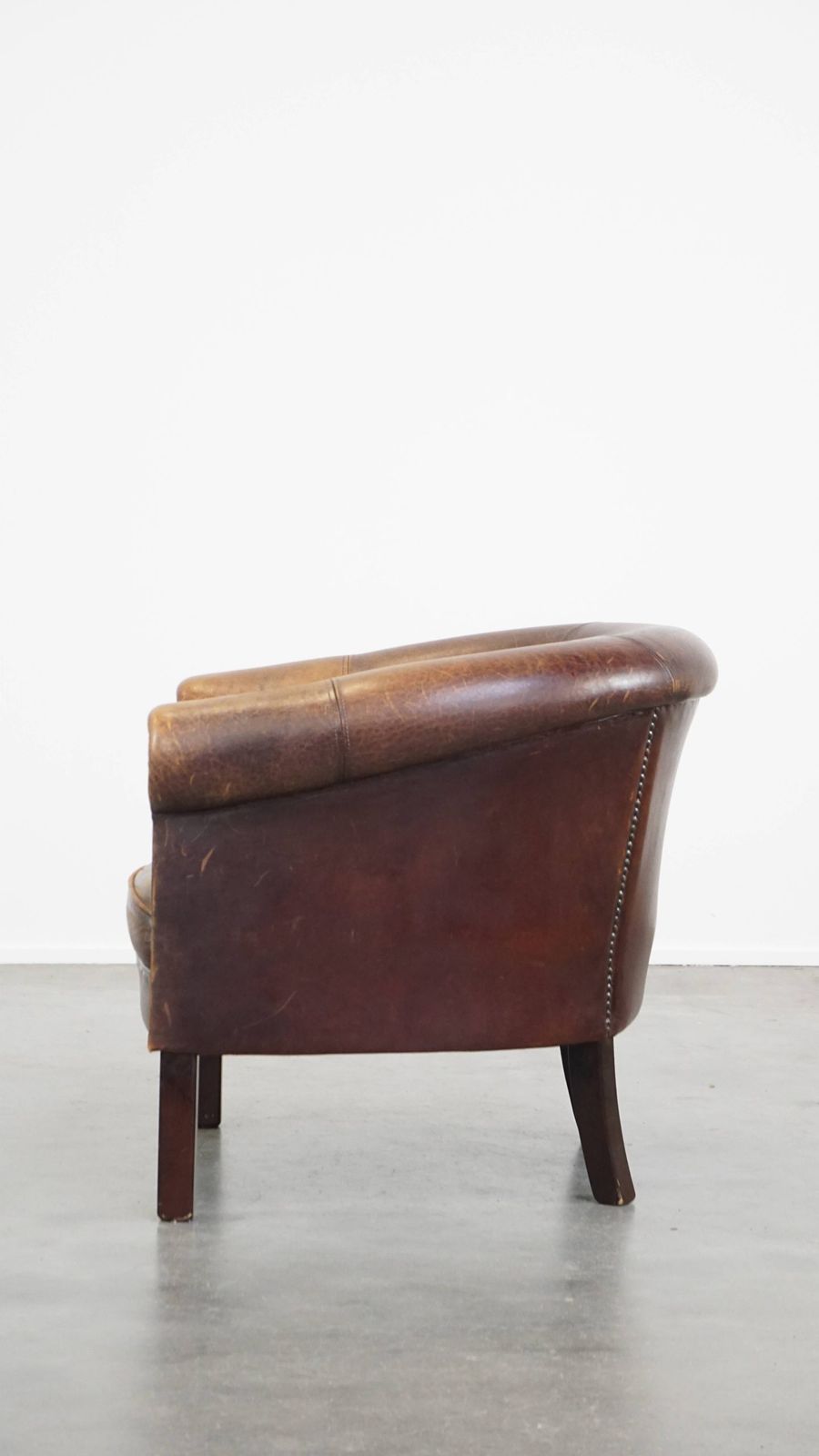Subtle Sheepskin Club Chair With A Robust Appearance And Neatly Finished With Decorative Nails photo 669.4793999999999