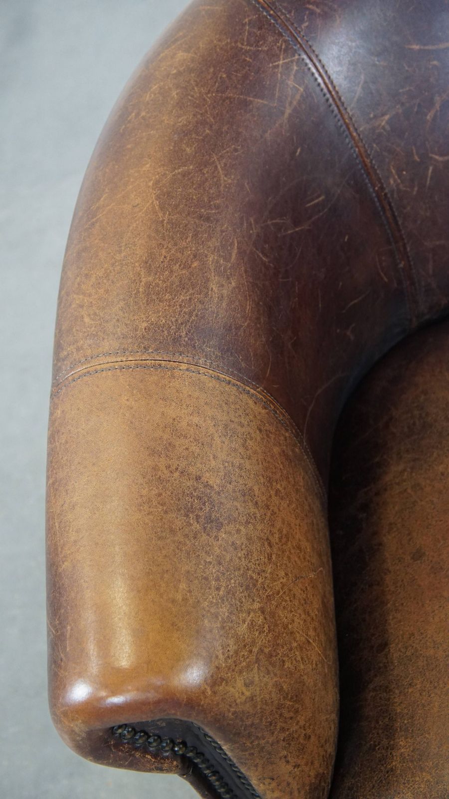 Subtle Sheepskin Club Chair With A Robust Appearance And Neatly Finished With Decorative Nails photo buy