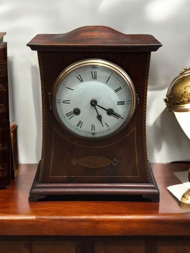 An Arts And Crafts Mantle Clock With Inlay Liberty & Co?
