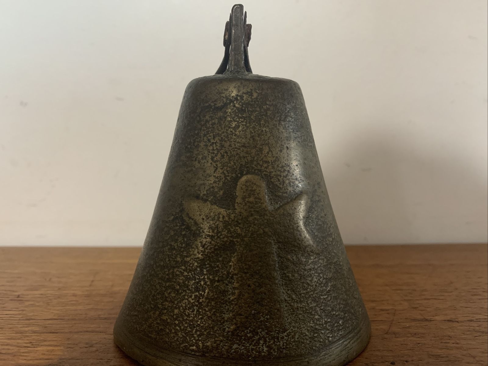 photo furniture Antique Primitive Brass Bell With Cross