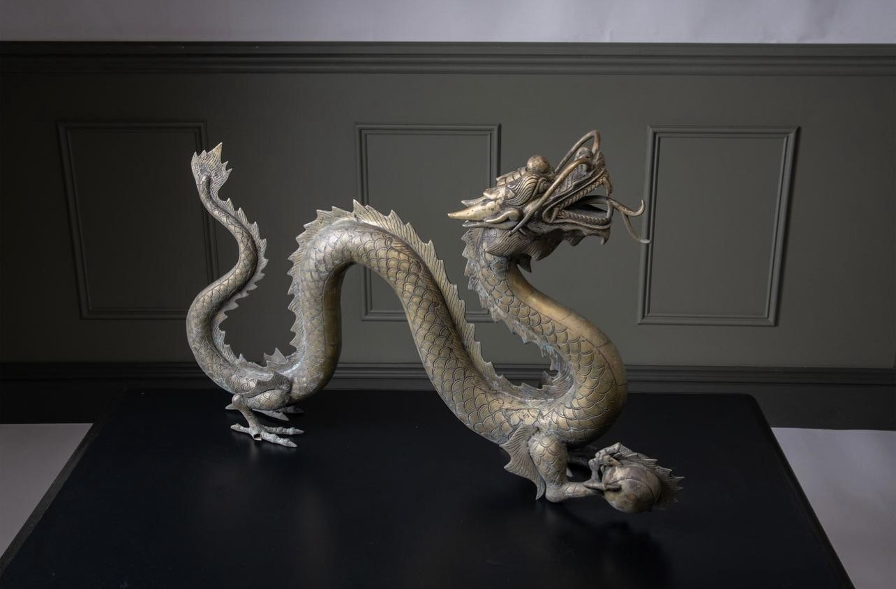 A Large Brass Dragon Chasing The Flaming Pearl Of Knowledge photo furniture