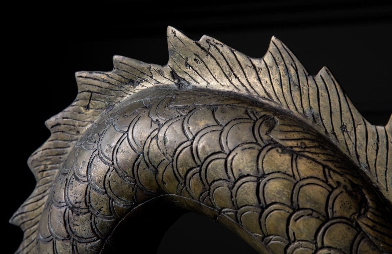 A Large Brass Dragon Chasing The Flaming Pearl Of Knowledge photo buy