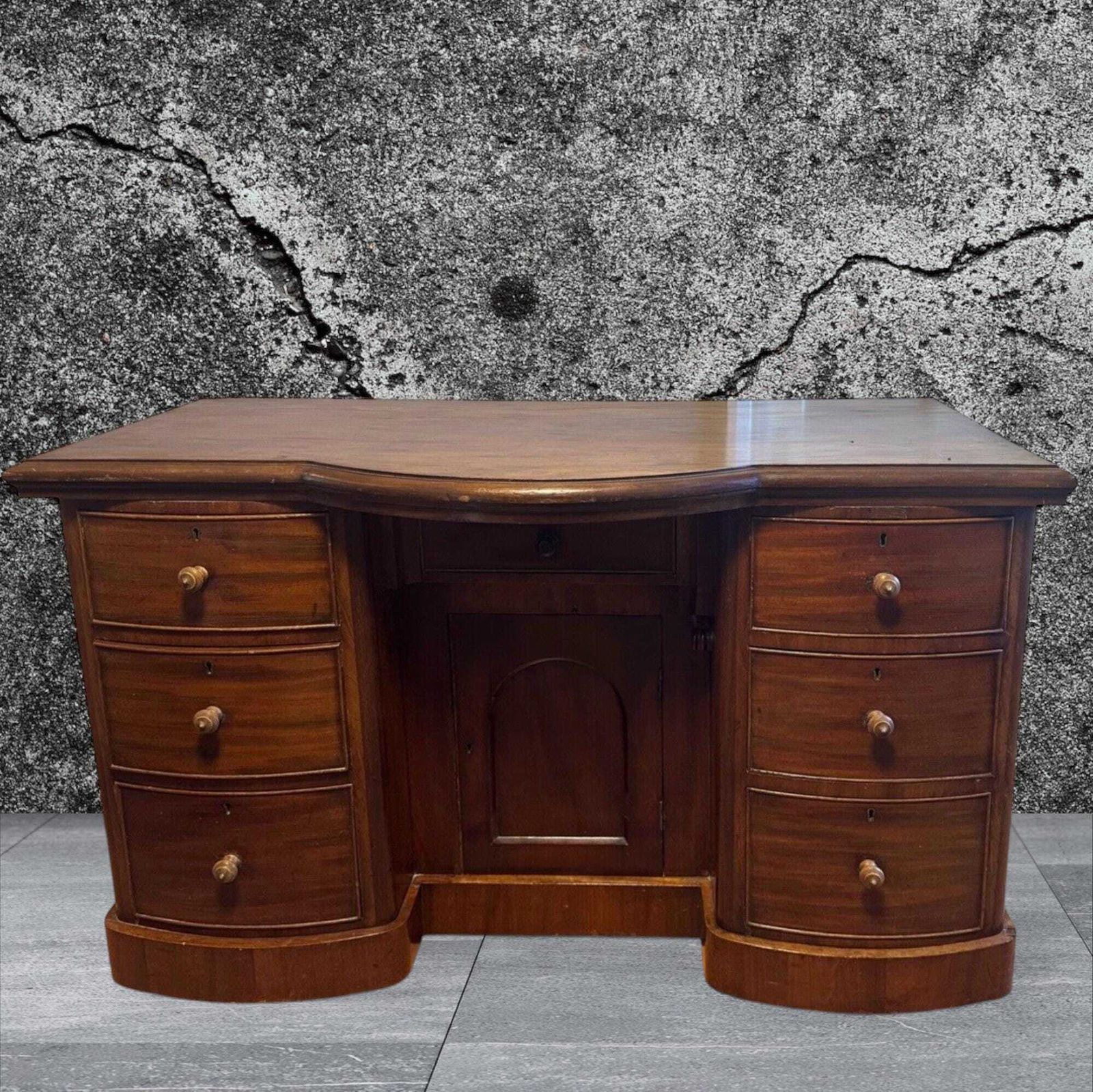 Late Victorian One Piece Mahogany Bow Breakfront Six Drawer Kneehole Desk