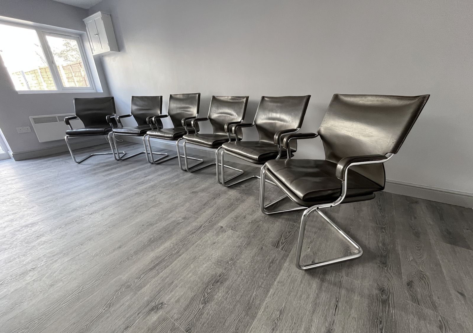 Set Of 6 Iconic Uno Chairs In Hand Stitched Heavy Grey Leather On Tubular Chrome Metal Cantilevered Frames.