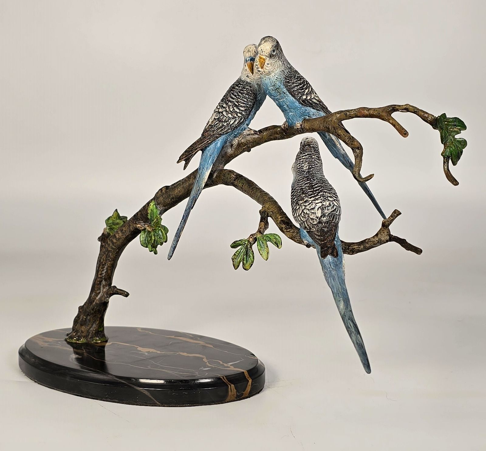 Vintage Austrian Cold Painted Bronze Study Of Three Budgerigars Perched On A Leafy Branch. photo vintage