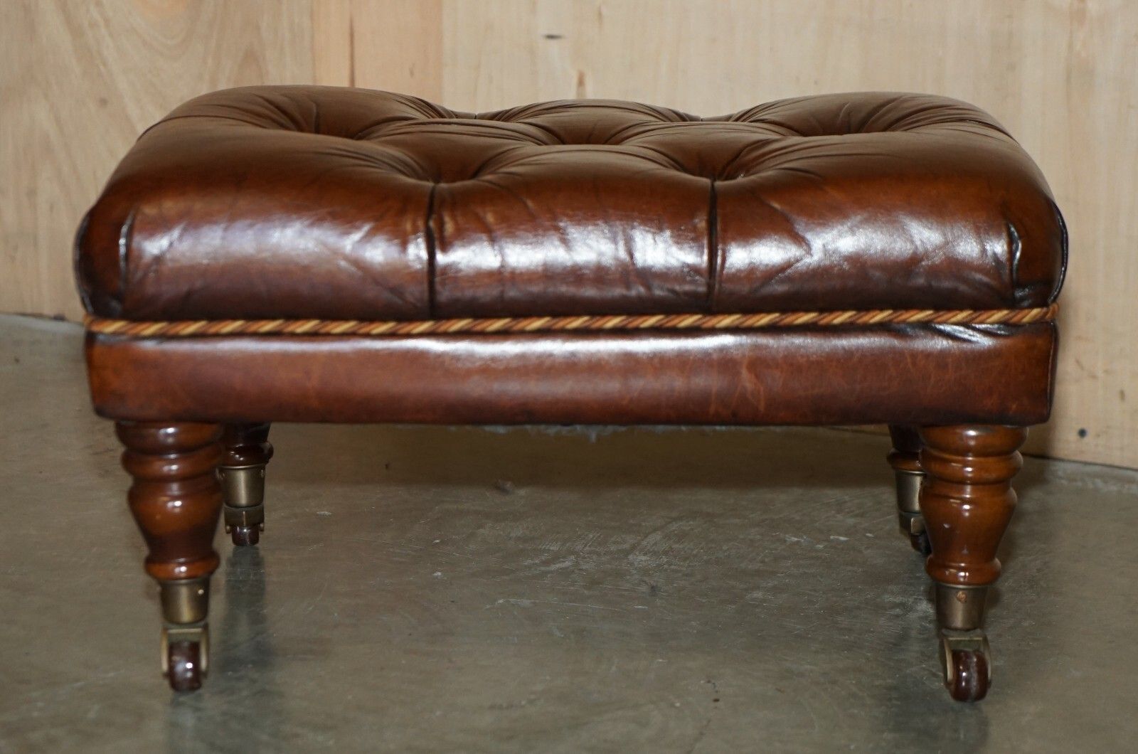 Pair Of Restored Brown Leather Chesterfield Tufted Porcelain Castors Footstools photo for sale