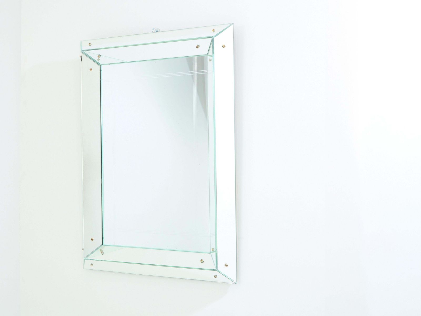 Miroir parclose Art déco à facettes Jacques Adnet, 1947 photo vinterior
