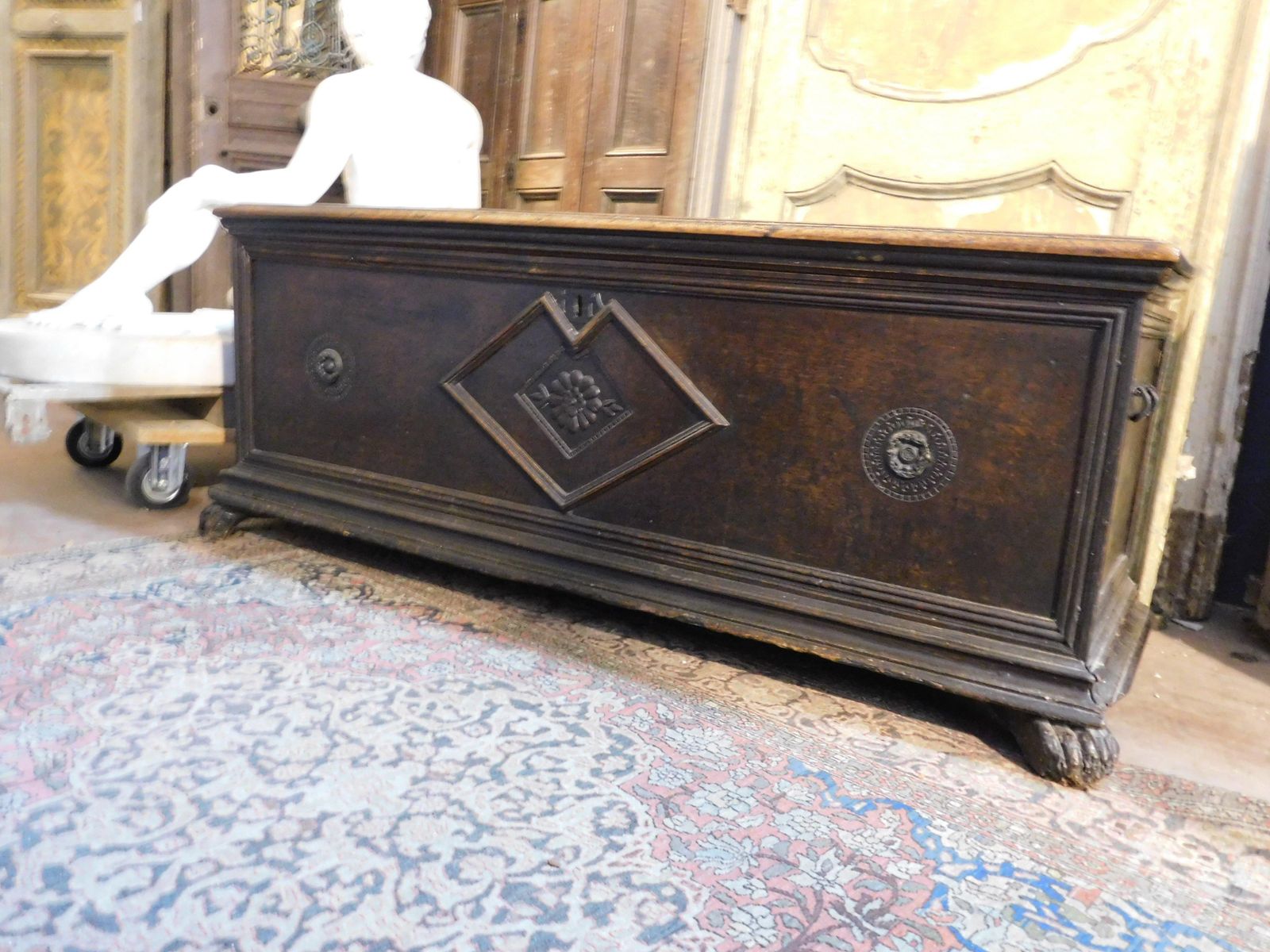 Chest In Walnut Wood, Carved With Three Flowers And Lion's Paw Feet, Italy photo for sale