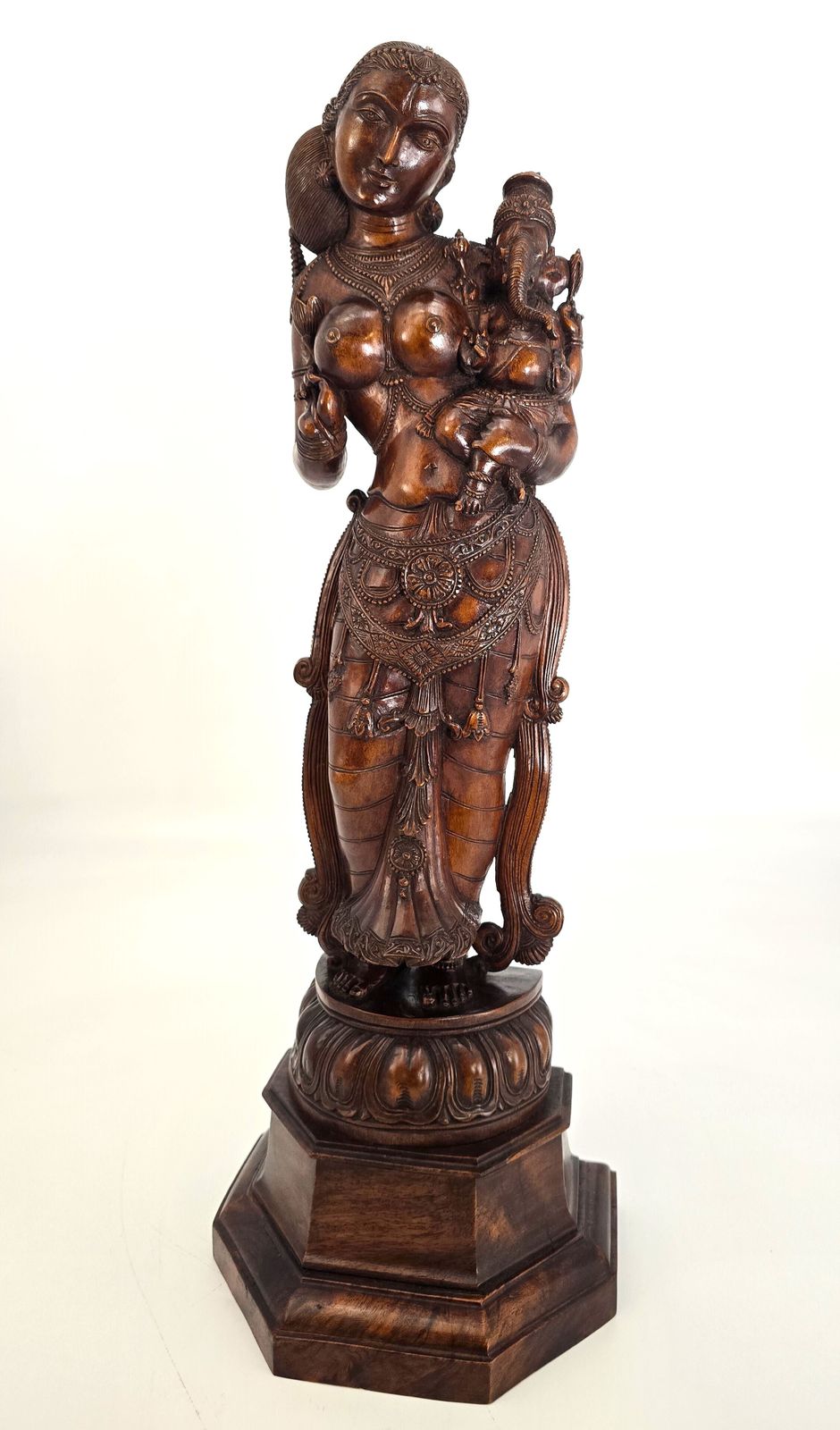 Carved Indian Figure Of The Goddess Parvati Holding Her Baby Son Ganesha, From The Raj Period, Circa 1900 photo buy
