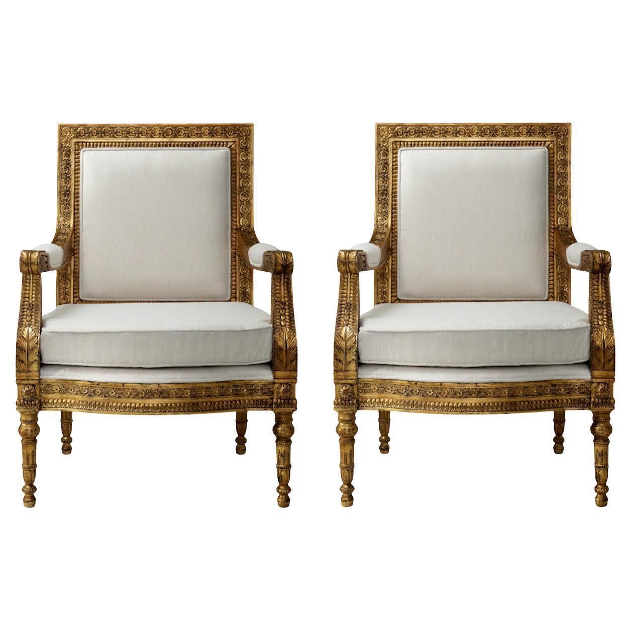 Pair Of Louis XVI Style Armchairs In Gilded Wood.