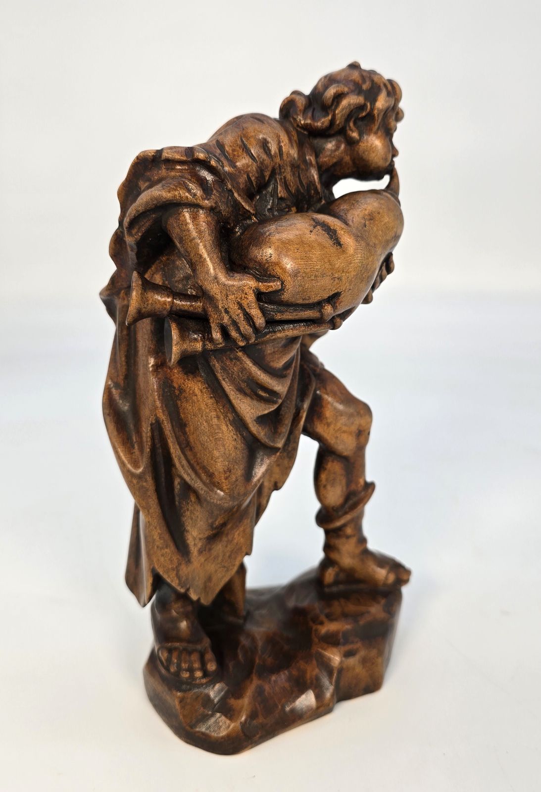 photo for sale A Swiss Vintage Wooden Limewood Carving A Man Playing The Bagpipes, Circa 1880