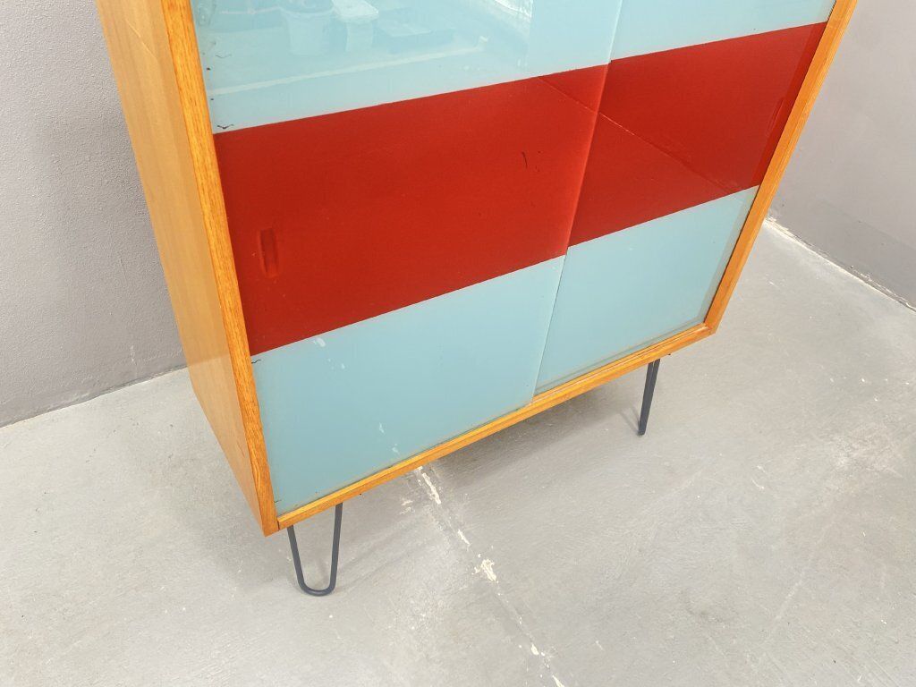Dřevotvar Hradec Králové Cabinet With Metal Legs And Colored Glass photo vinterior