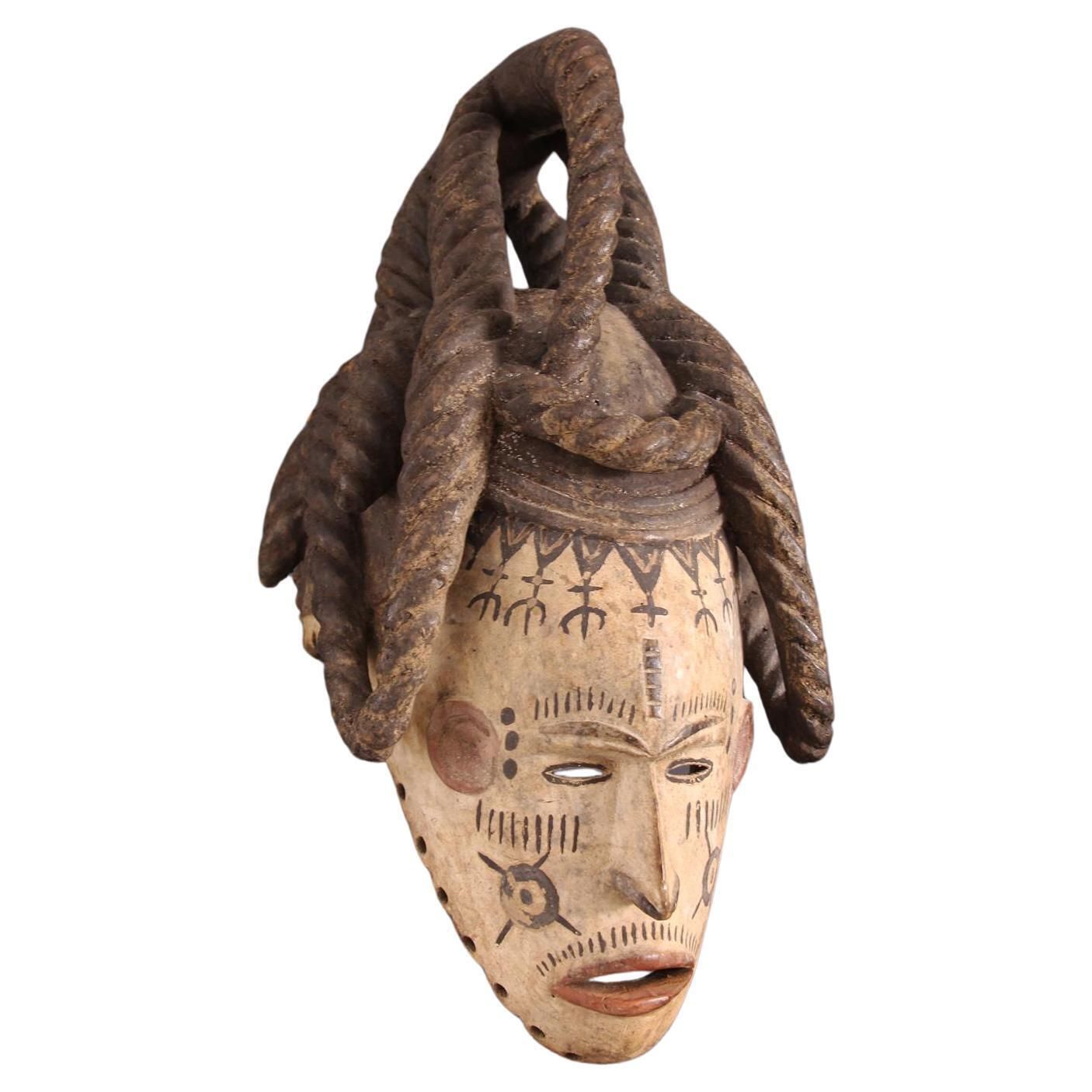 African Wooden Female Igbo Agbogo Tribal Mask Brown Red Beige Nigeria 1970s photo for sale