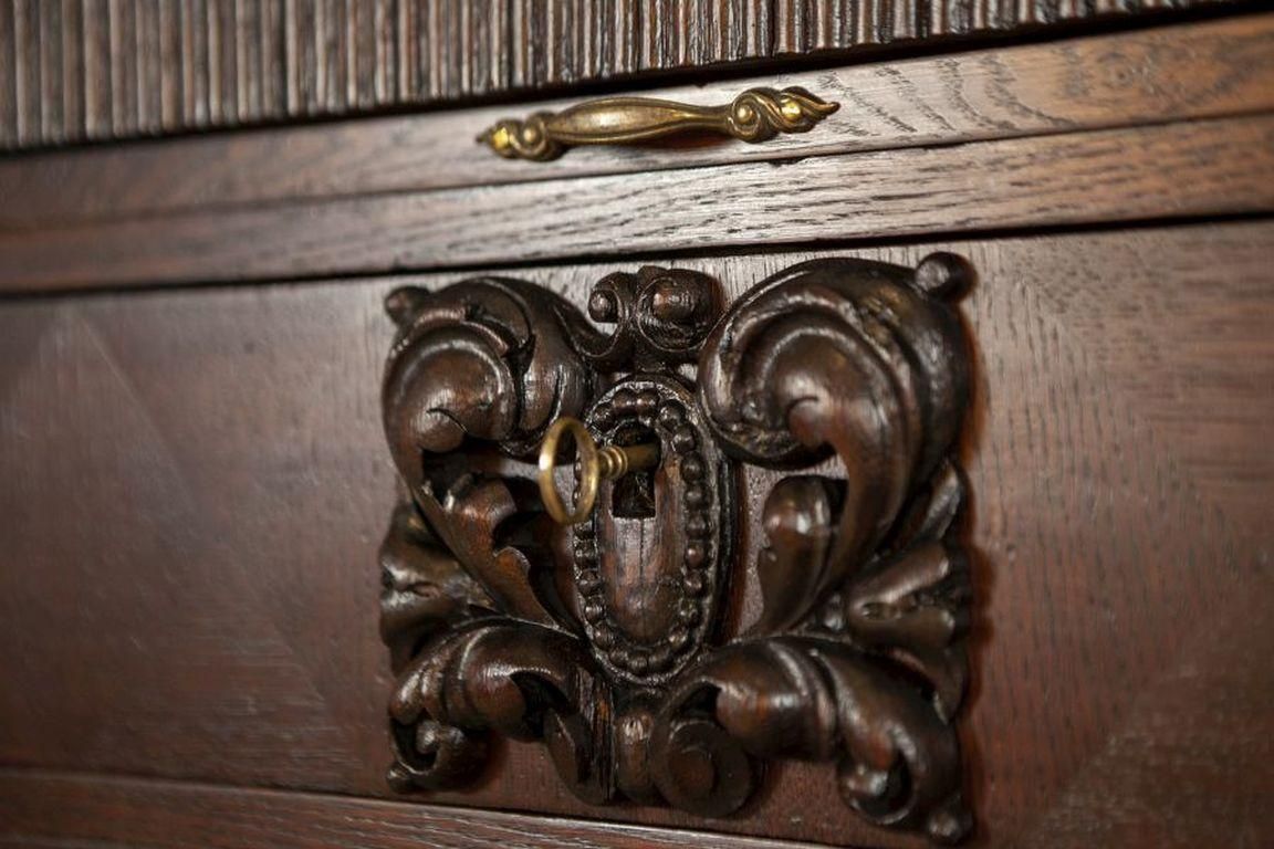 photo vintage Decorative Oak Sideboard From The Interwar Period In Dark Brown
