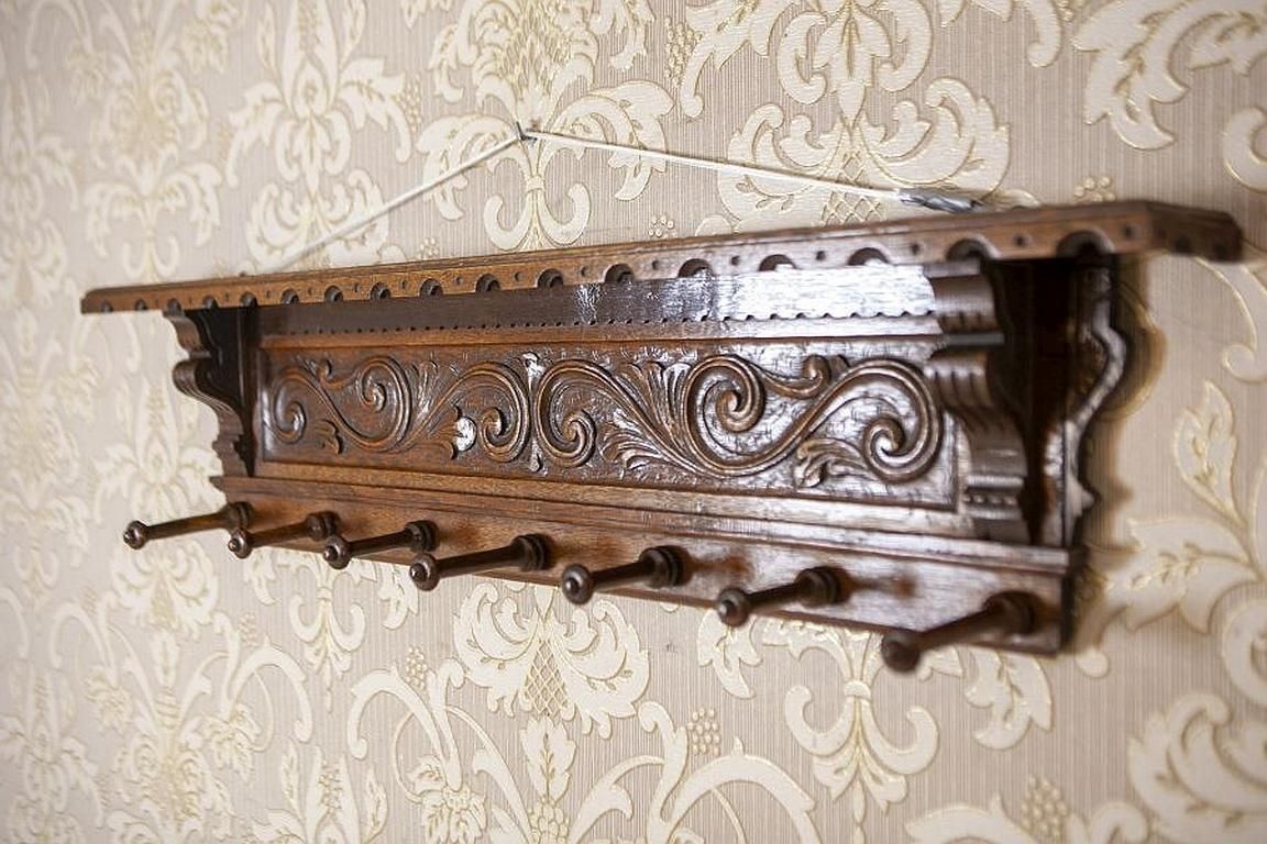 Oak Coat Rack From The Early 20th Century In Dark Brown photo furniture