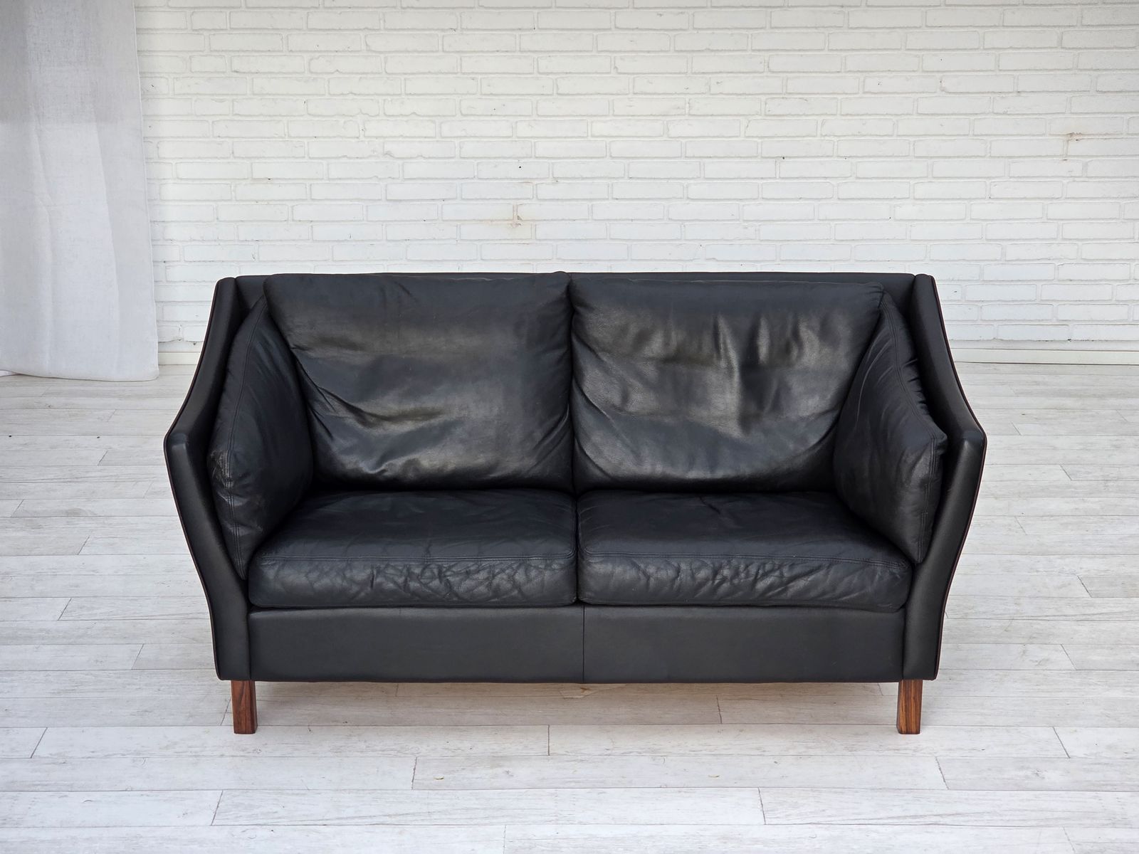 1970s, Danish 2 Seater Sofa, Original Black Furniture Leather, Teak Wood Legs. photo vintage