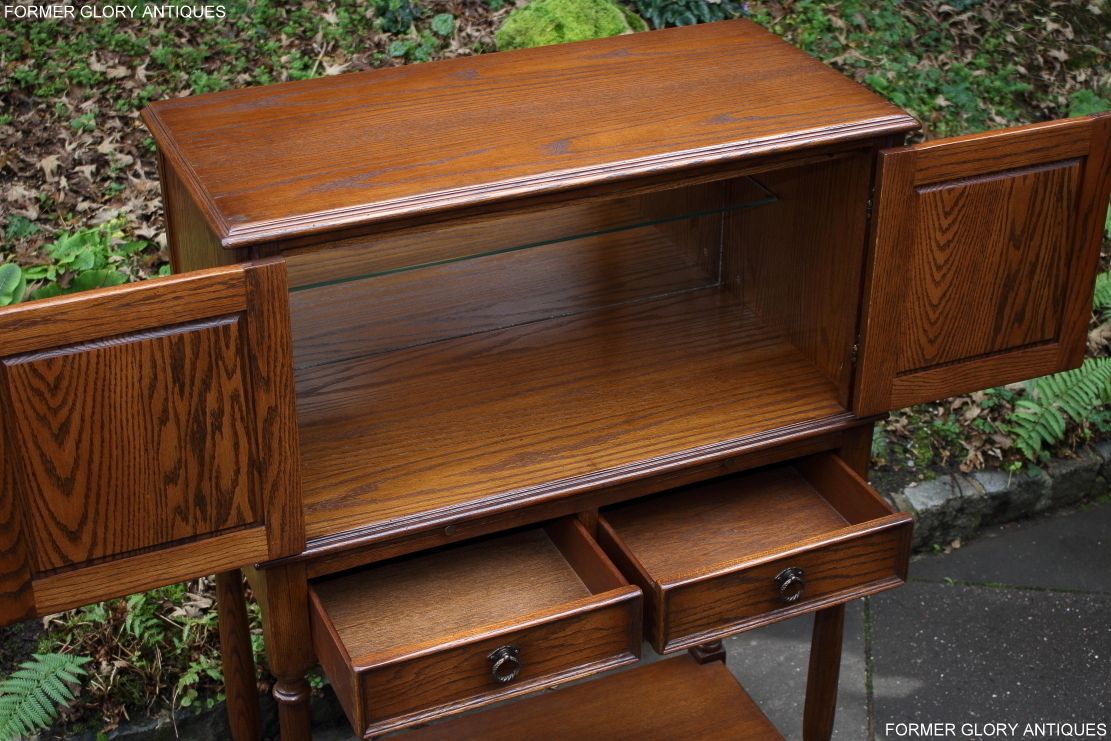 photo furniture A Jaycee Autumn Gold Carved Oak Drinks / Cocktail / Wine Cabinet