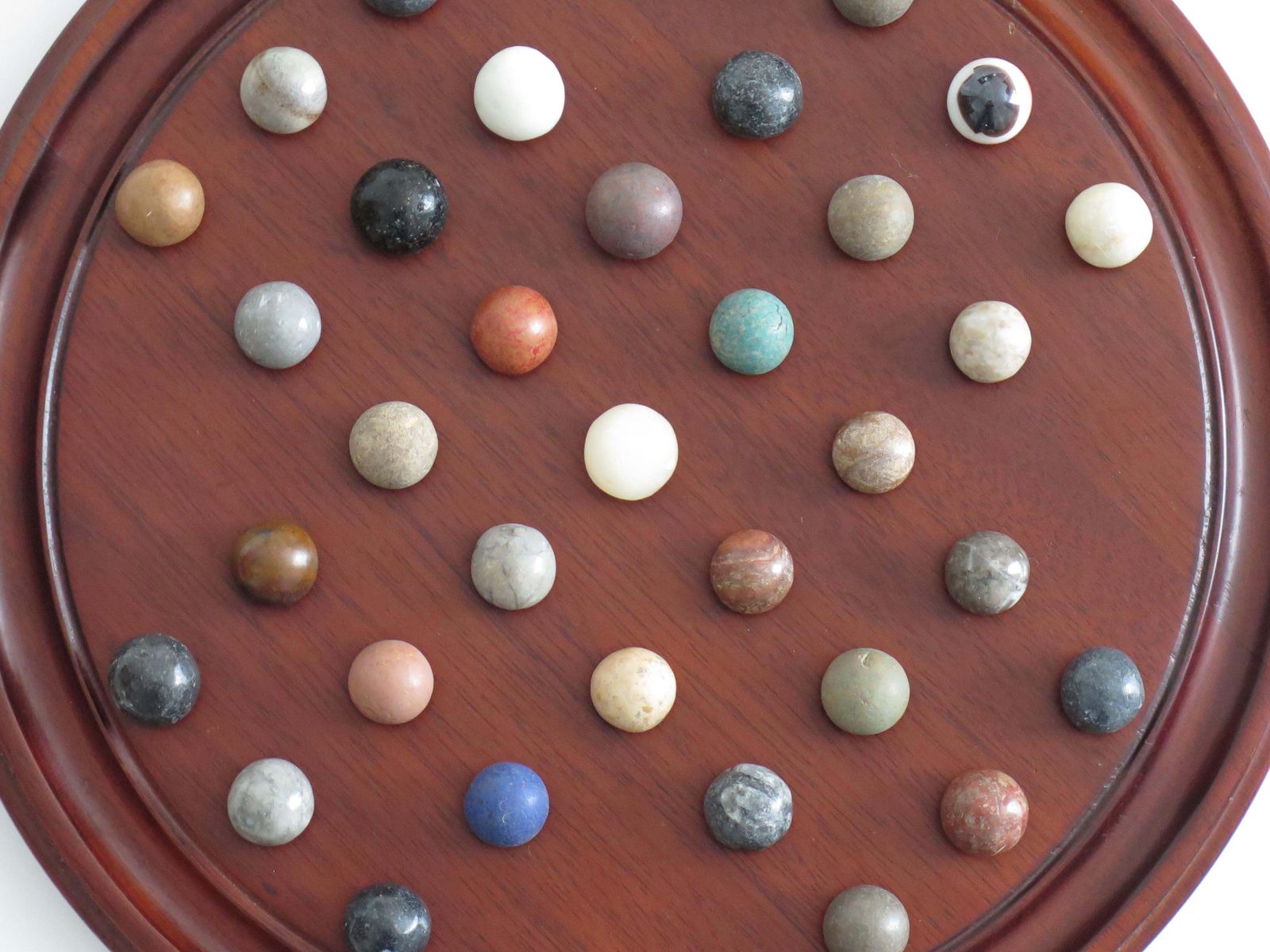 310.0 Marble Solitaire Game 10 Inch Hardwood Board 35 Mixed Stone Marbles, Circa 1945 photo