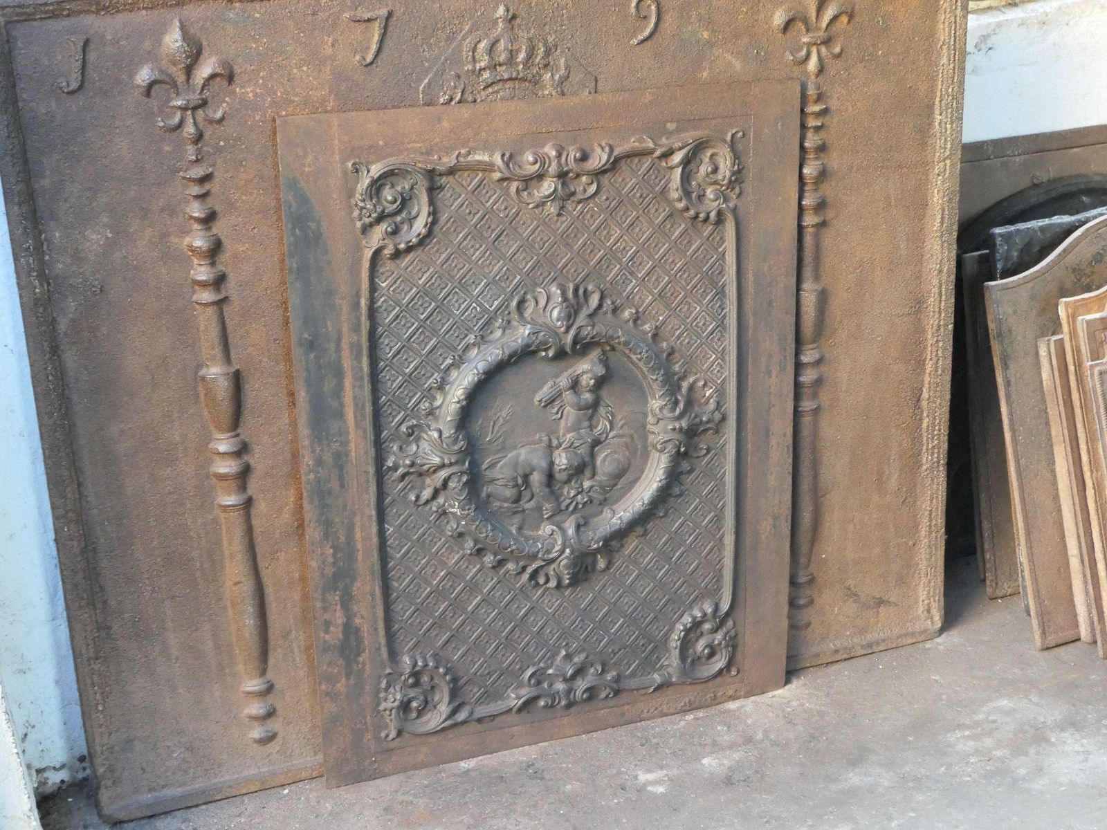 French Early 20th Century Louis XV Style 'Cupids' Fireback / Backsplash. photo Home Fixtures