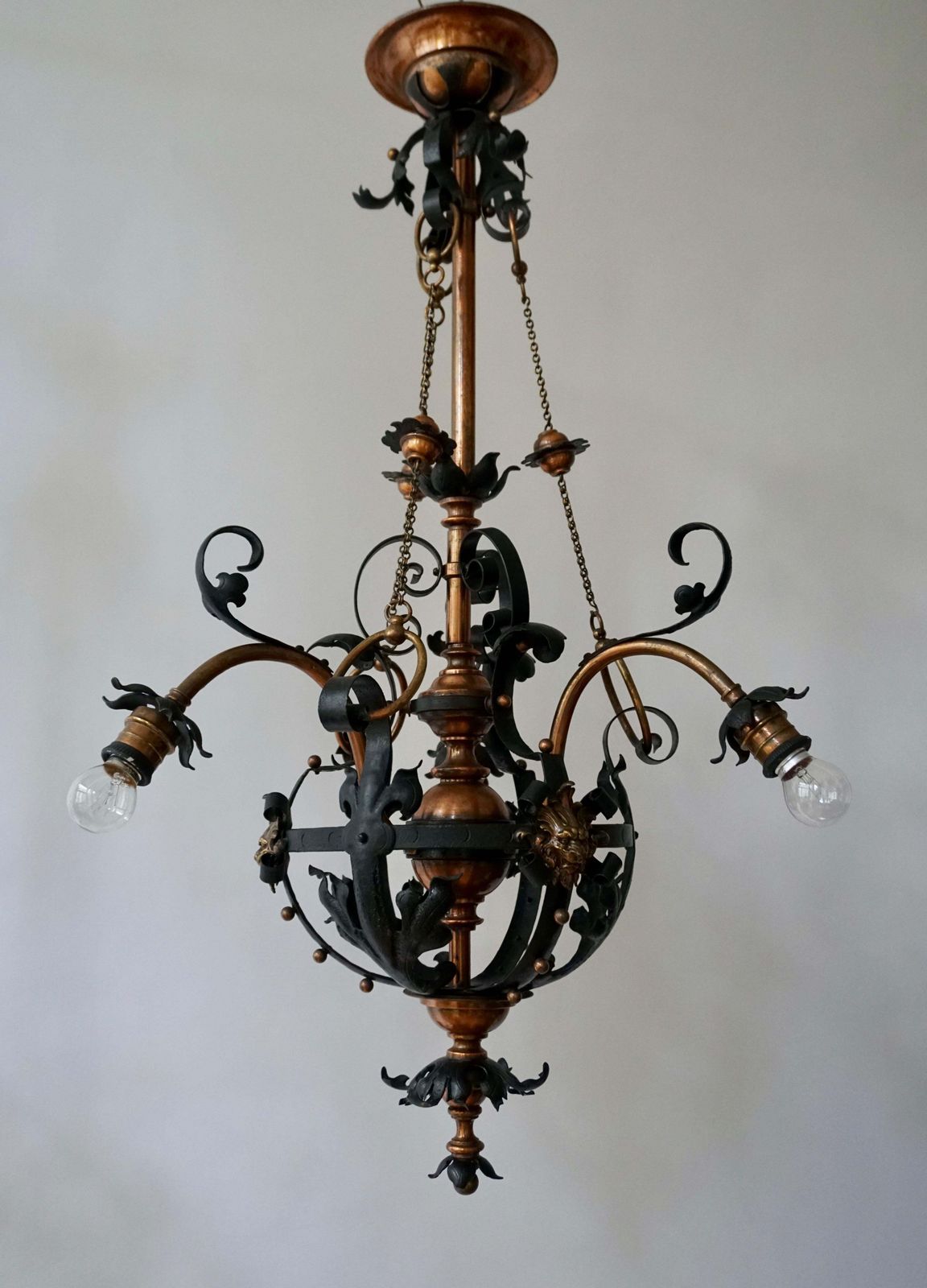 Lighting Arts & Crafts Wrought Iron And Copper Castle Chandelier With Bronze Lion Heads photo