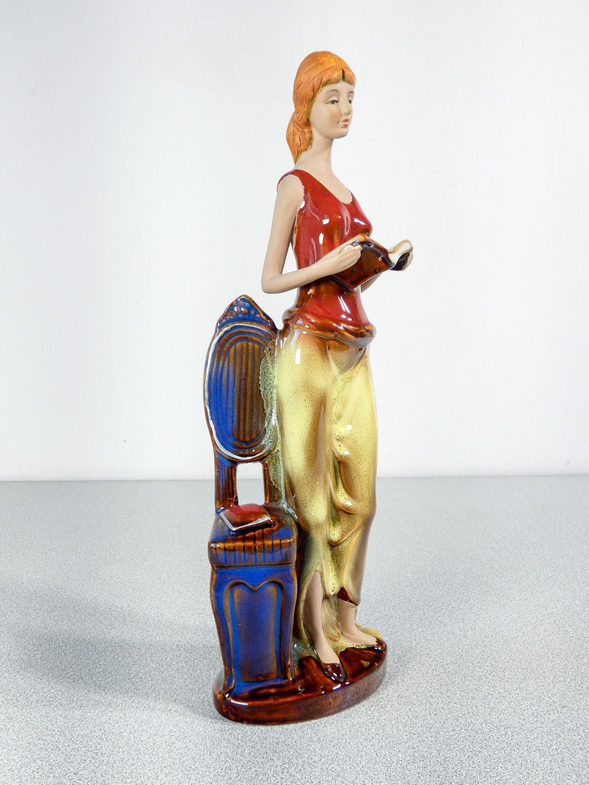 Painted And Glazed Ceramic Sculpture. Woman With Books. Italy photo furniture
