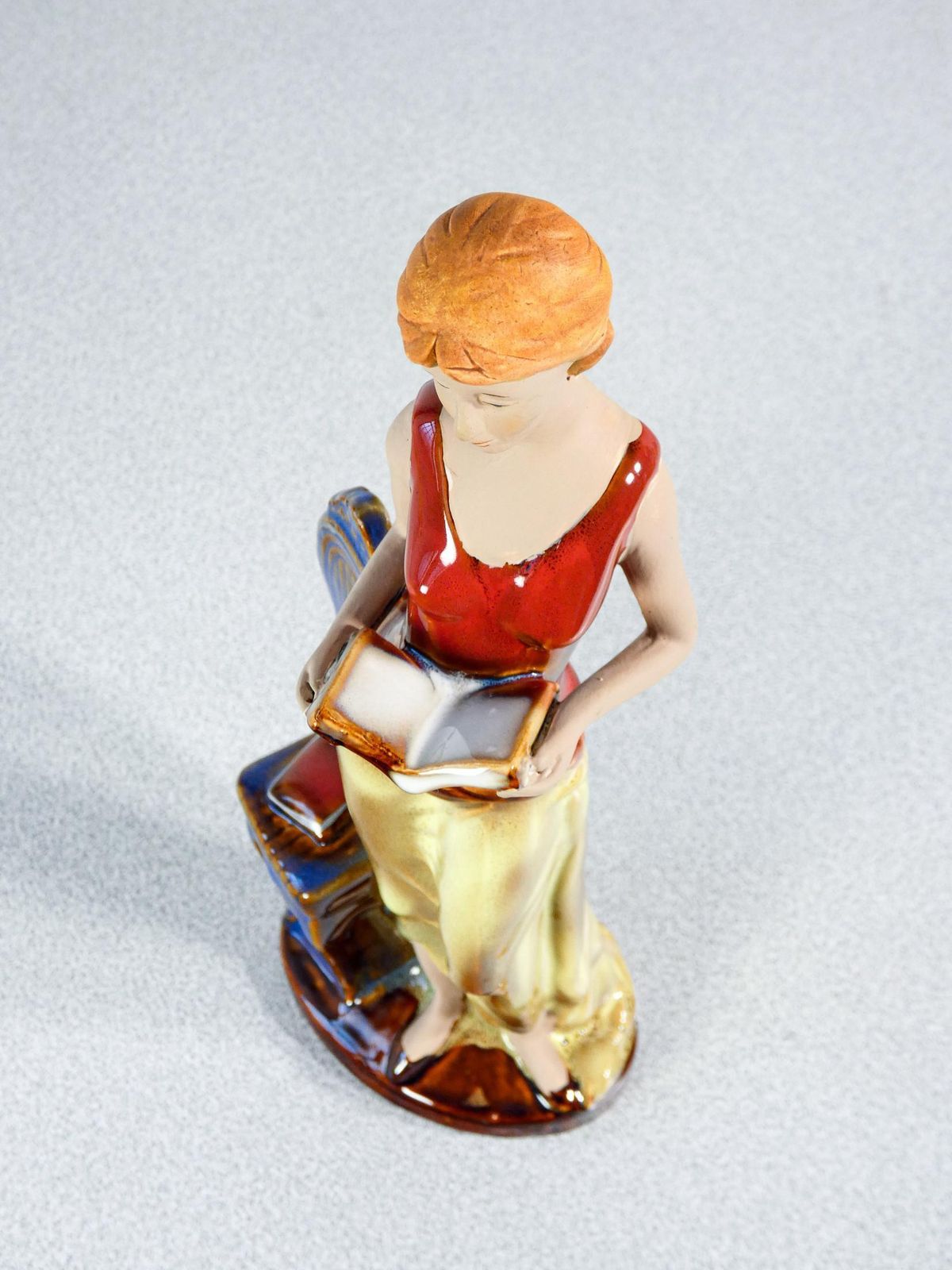 Painted And Glazed Ceramic Sculpture. Woman With Books. Italy photo buy