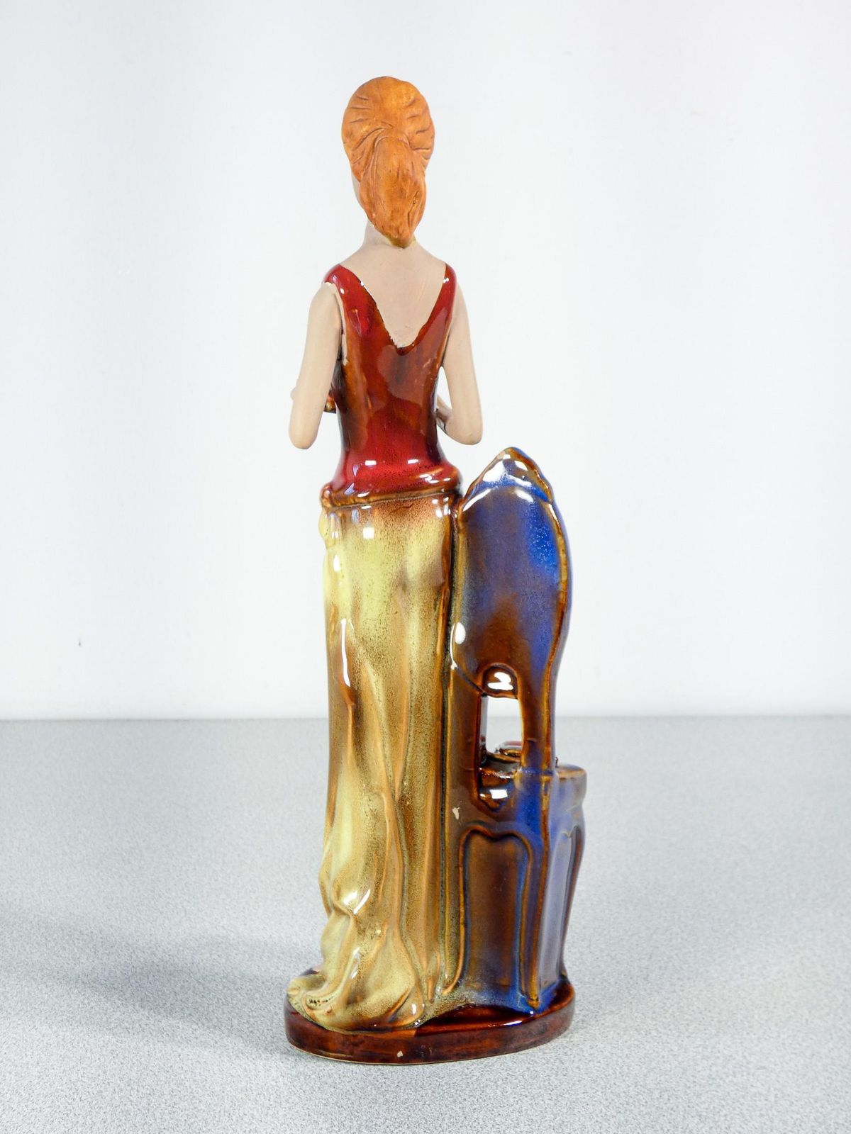 photo for sale Painted And Glazed Ceramic Sculpture. Woman With Books. Italy