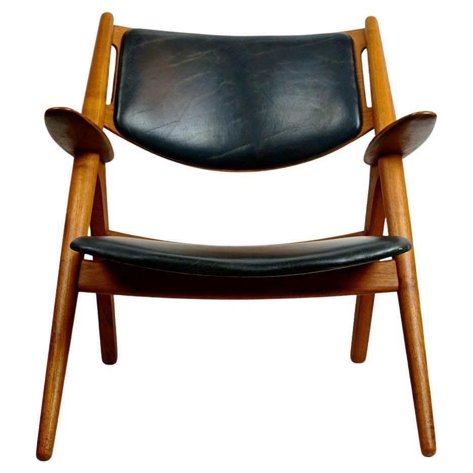 Scandinavian Teak And Black Leather Ch28 Chair By Hans Wegner For Carl Hansen