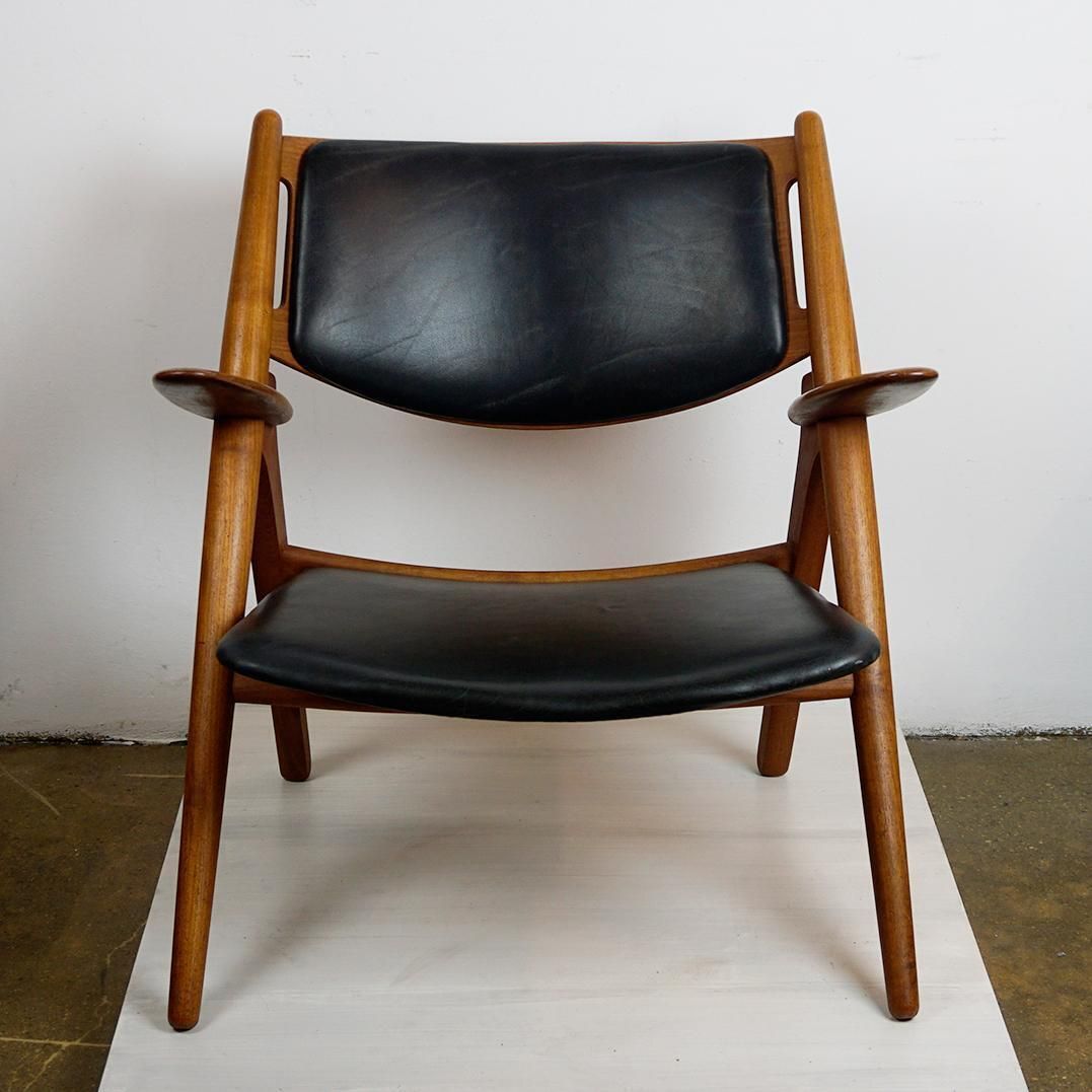Scandinavian Teak And Black Leather Ch28 Chair By Hans Wegner For Carl Hansen photo furniture