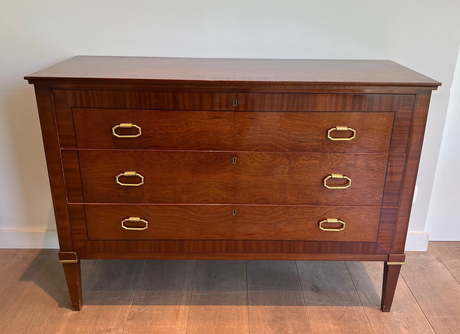2450.0 Neoclassical Chest Of Drawers In Mahogany Veneer And Brass By De Coene Frères photo