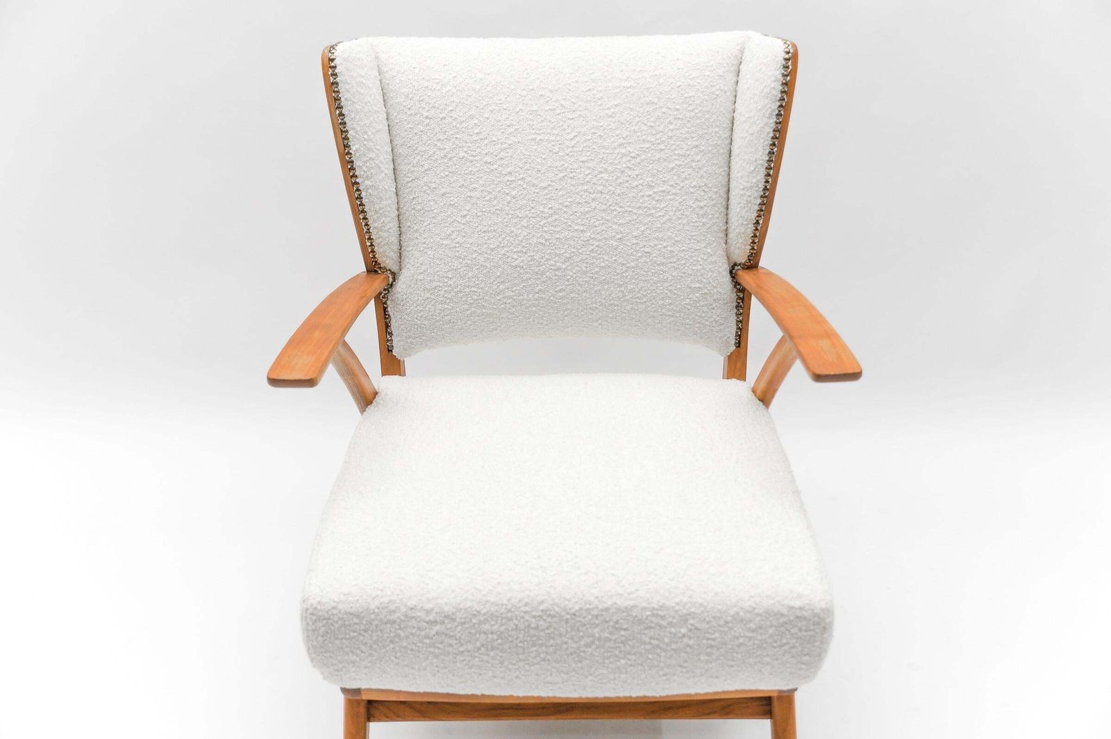 1572.0 White Boucle Fabric And Wooden Wingback Armchair, Italy, 1950s photo