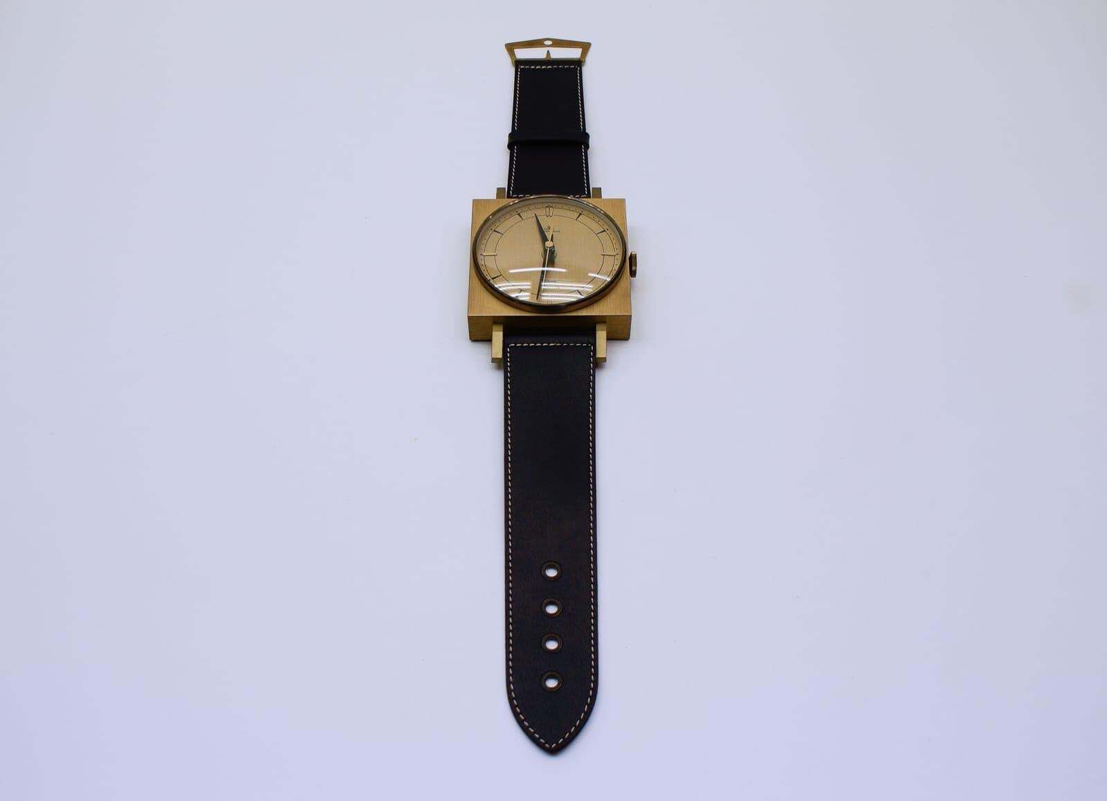 Midcentury Wall Clock In The Form Of A Wristwatch In Leather And Brass, Germany photo furniture