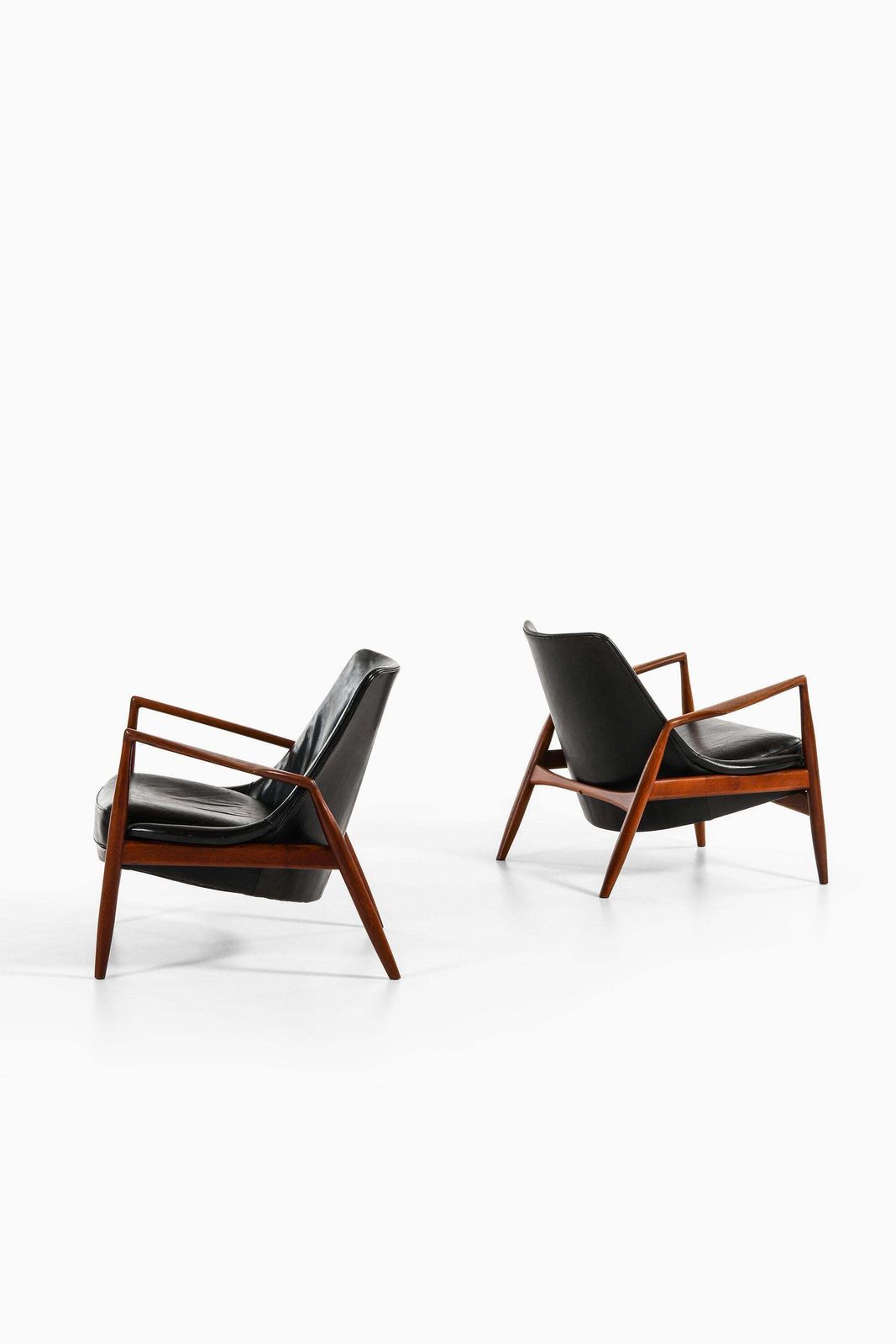 Pair Of Easy Chairs In Teak And Original Black Leather By Ib Kofod Larsen photo furniture