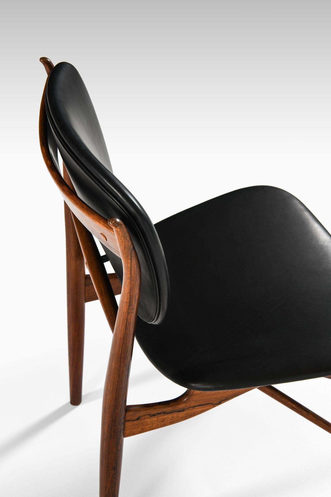 55208.0 Dining Chairs In Rosewood And Black Leather By Finn Juhl, 1951 photo