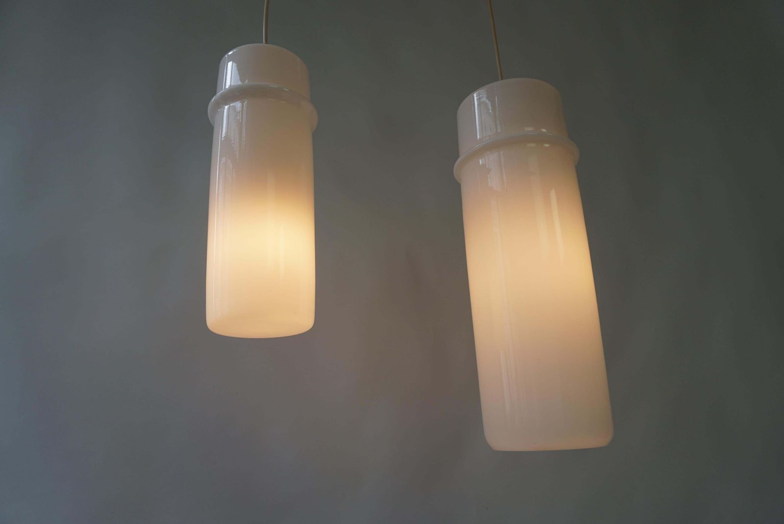 photo furniture Two Stilnovo Pendant Lamps In Murano Glass And Brass, Italy, 1960s.