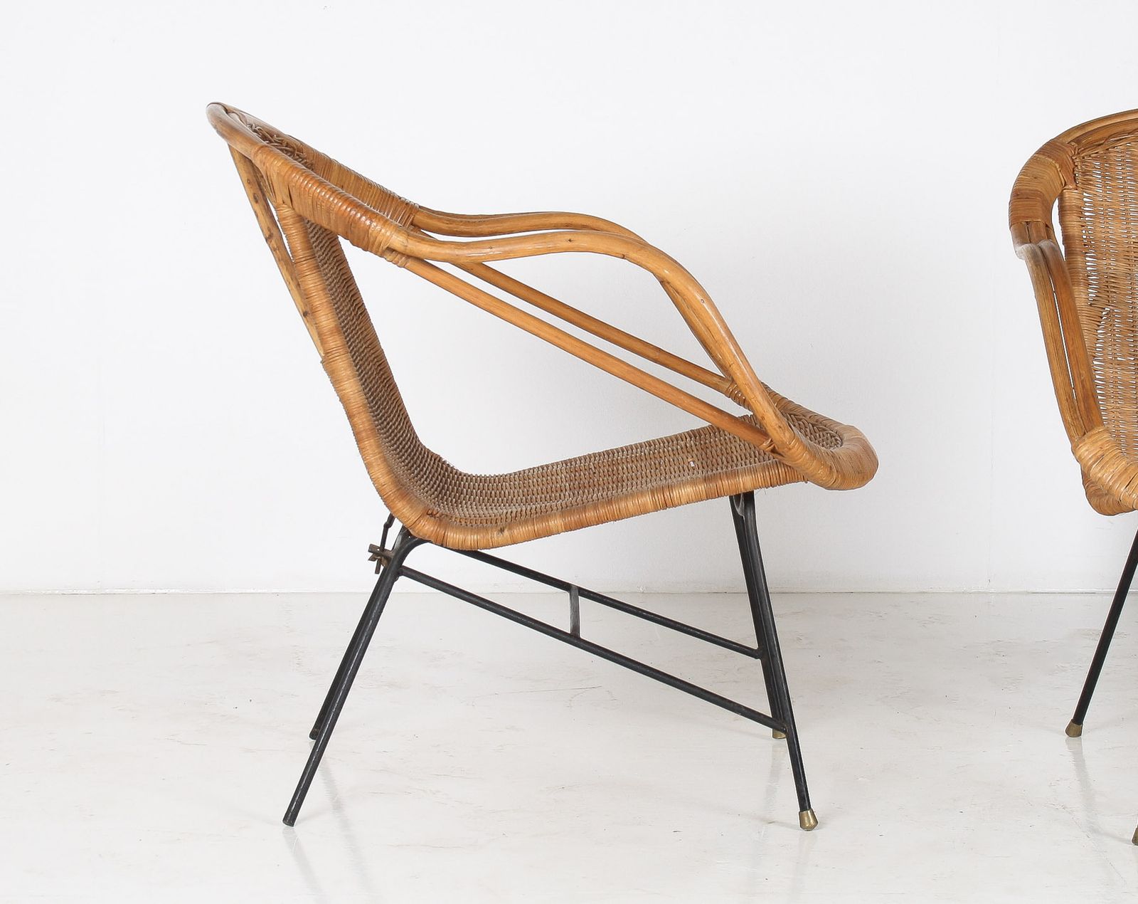 A Pair Of 1950s Mid Century Rattan Basket Chairs In The Manner Of Arthur Umanoff photo furniture