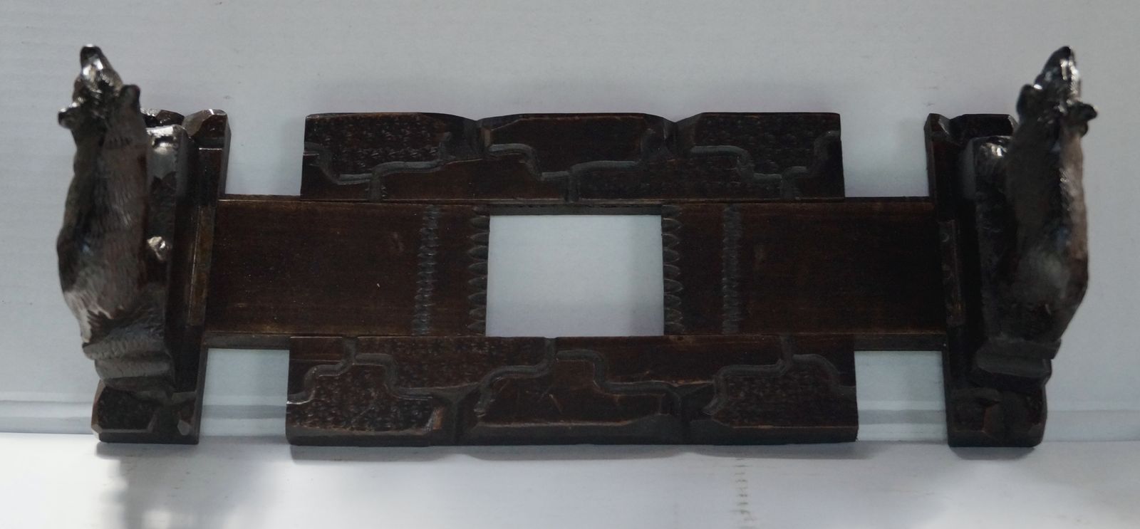 645.0 Antique Hand Carved Black Forest Extending Book Rack photo