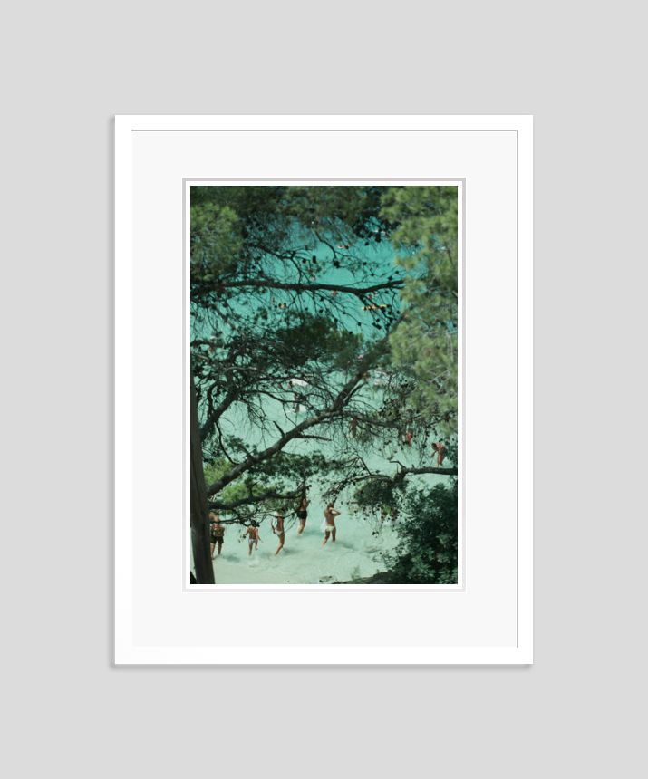 Slim Aarons 'Beach Near Portinatx' Framed White photo furniture