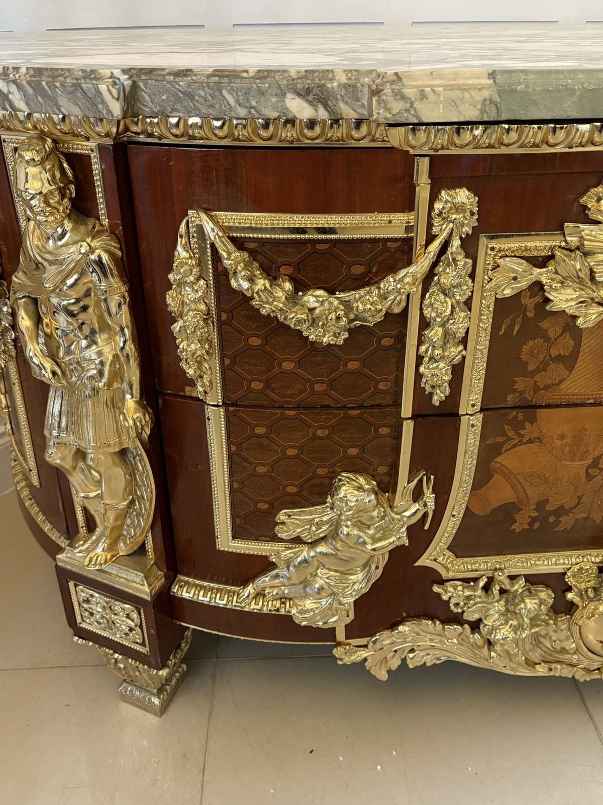485000.0 Antique Rare Fine Pair Of French Marquetry And Gilt Bronze Mounted Commodes In The Louis XVI Style, After Jean Henri Riesener photo