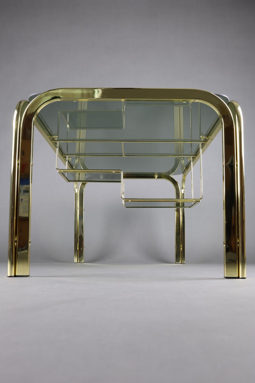 Vintage 1970s Smoked Glass Coffee Table With Gold Accents | Glass Top Table For Living Room | Rectangular Coffee Table With Storage Shelf photo Furniture