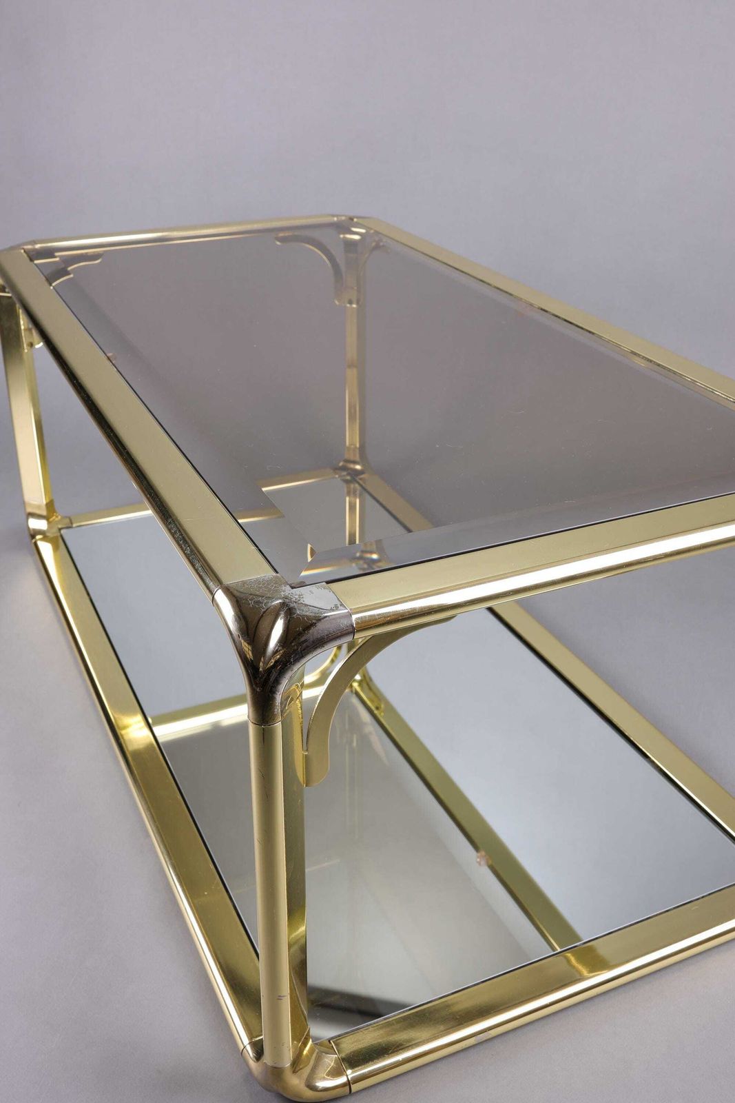 photo furniture 1970s Hollywood Regency Smoked Glass Coffee Table | Gold Accents Table | Glam Mid Century Modern Furniture