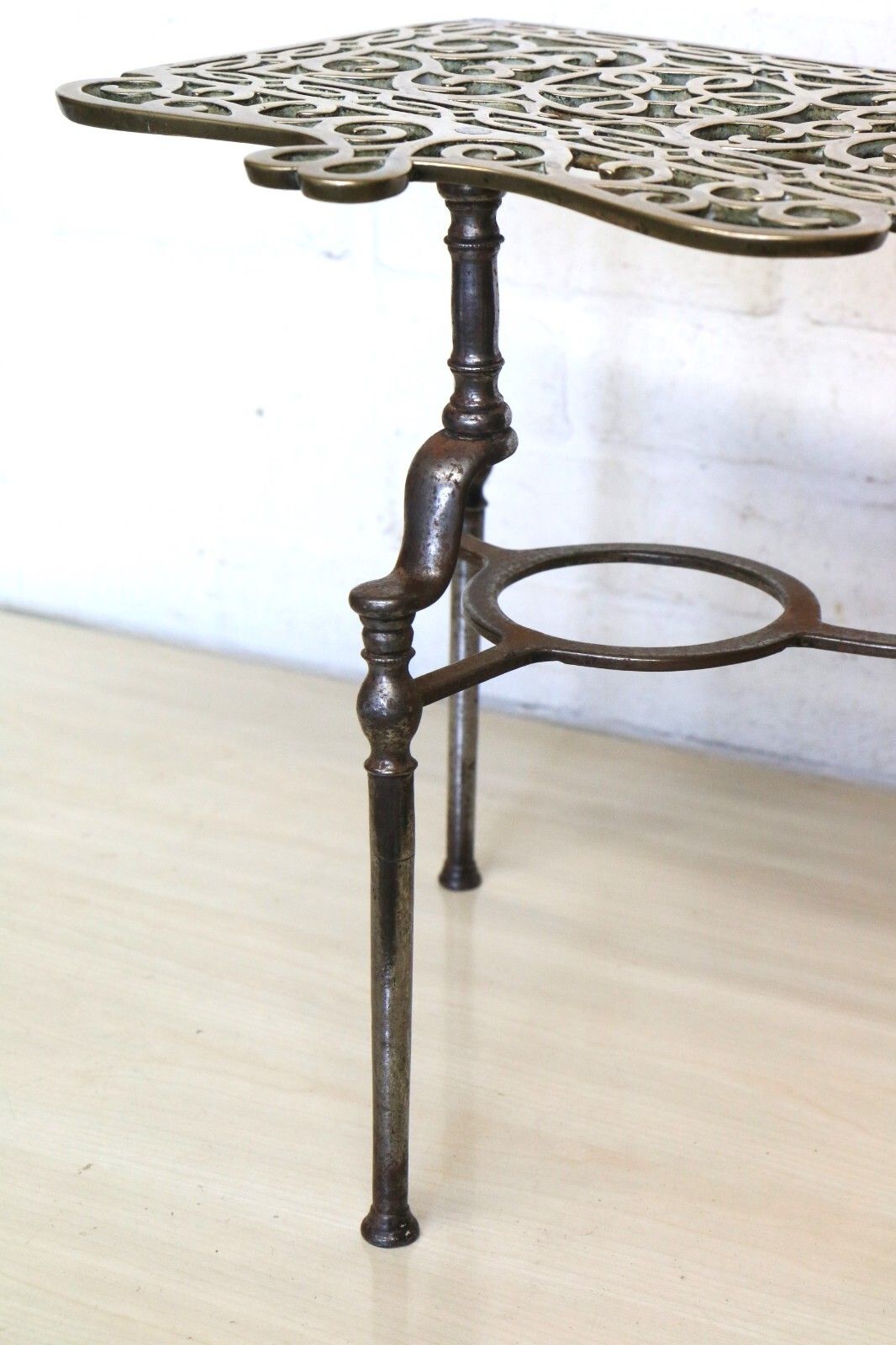 photo for sale Antique Brass Footman Trivet Mid 19th Century Decorative Wrought Iron Base